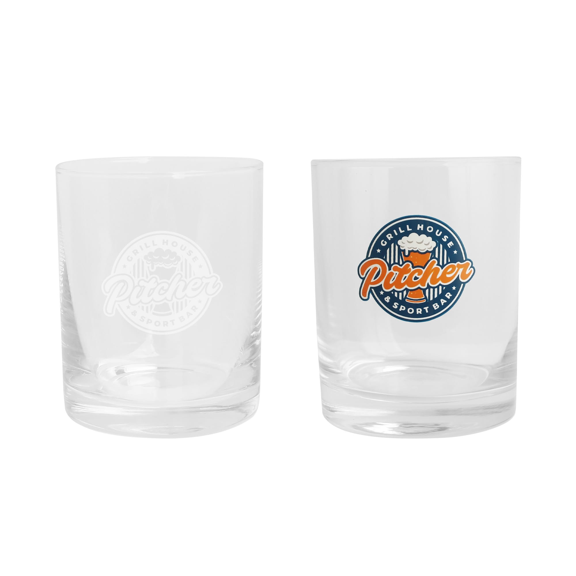 A whiskey glass set featuring clear glass with a logo, one etched and one coloured in orange and blue. Whiskey Glass - Image 1