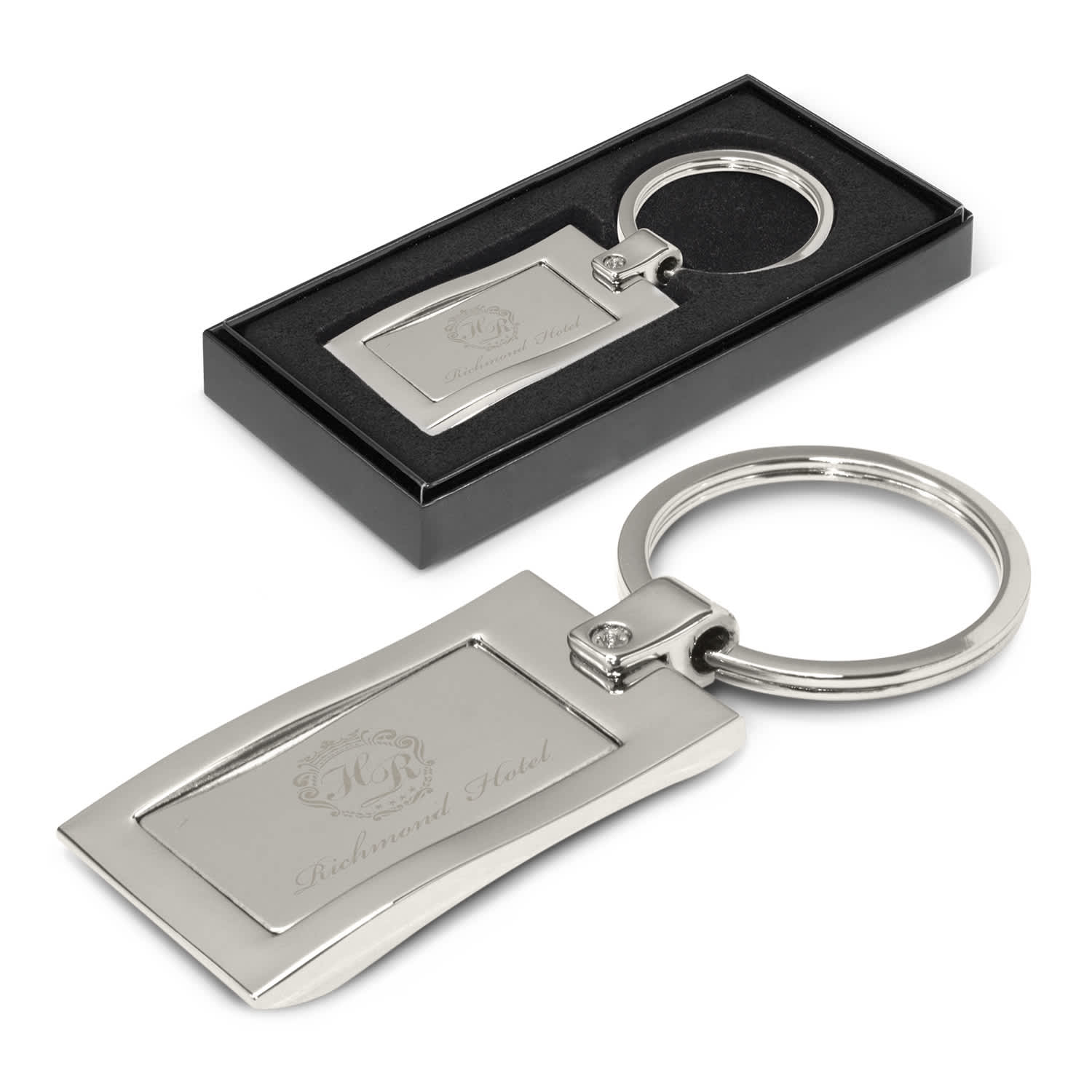 A silver metal key ring in a black presentation box with an engraved design. Wave Metal Key Ring - Image 1