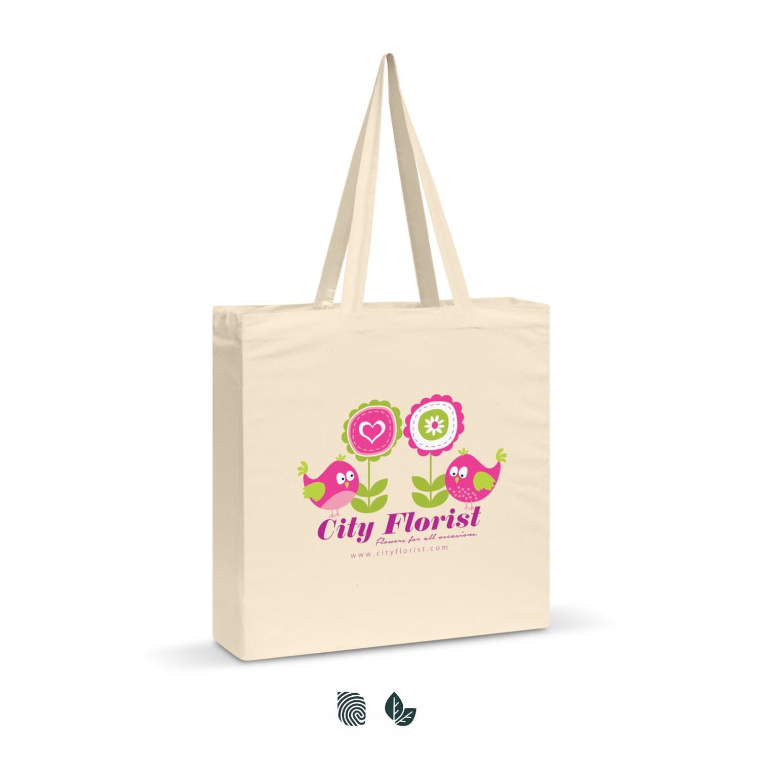A cotton shoulder tote bag in natural colour featuring birds and flowers with a logo. Carnaby Cotton Shoulder Tote - Image 1