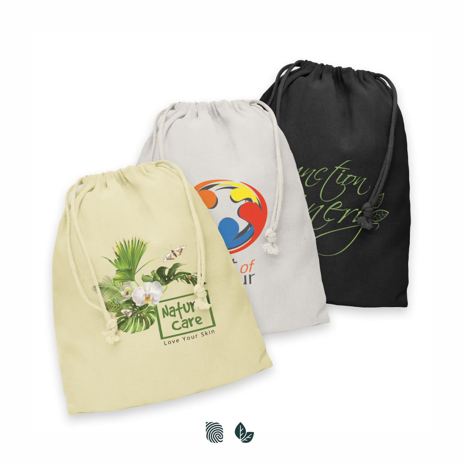 A large cotton gift bag collection featuring beige, grey, and black bags, each with unique designs and logos. Cotton Gift Bag - Large - Image 1