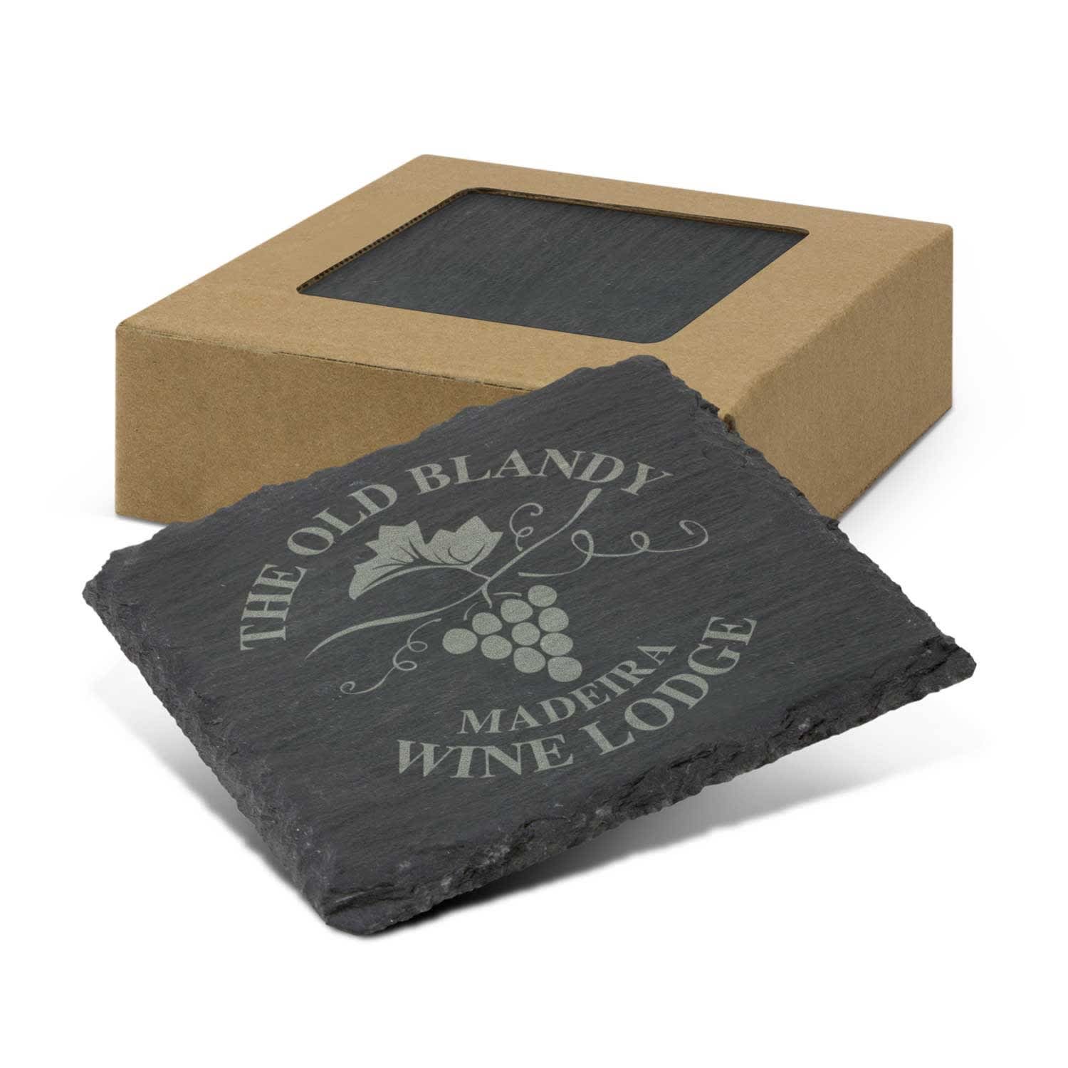 A set of four black slate coasters inside a cardboard box, featuring a grapevine design and a logo. Slate Coaster - Set of 4 - Image 1
