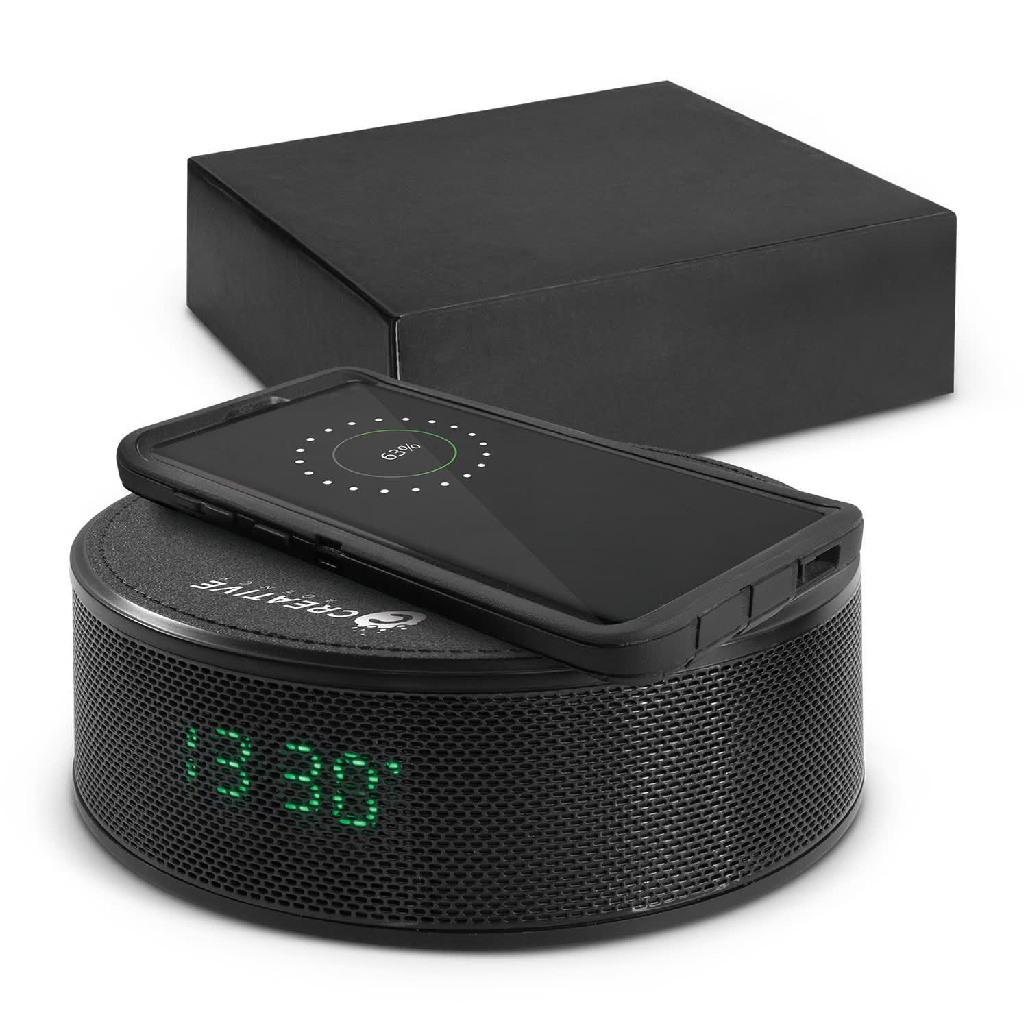 A black wireless charger and speaker with a digital clock display, accompanied by a black box. Zulu Speaker Wireless Charger - Image 1