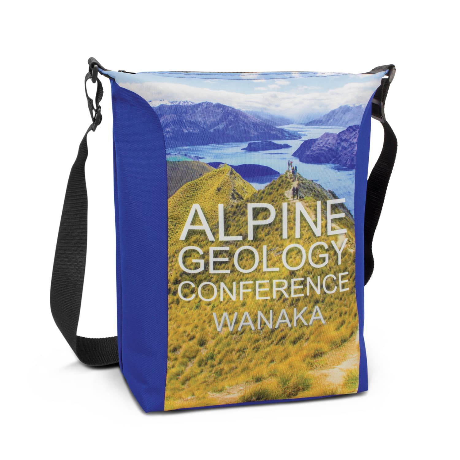 A cooler bag in blue featuring a scenic landscape design, with a shoulder strap and a branded logo. Monaro Conference Cooler - Full Colour - Image 1