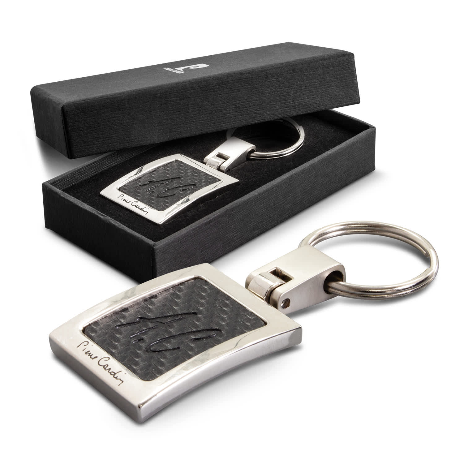 A silver key ring featuring a textured black design, presented in a black gift box. Pierre Cardin Avant-Garde Key Ring - Image 1