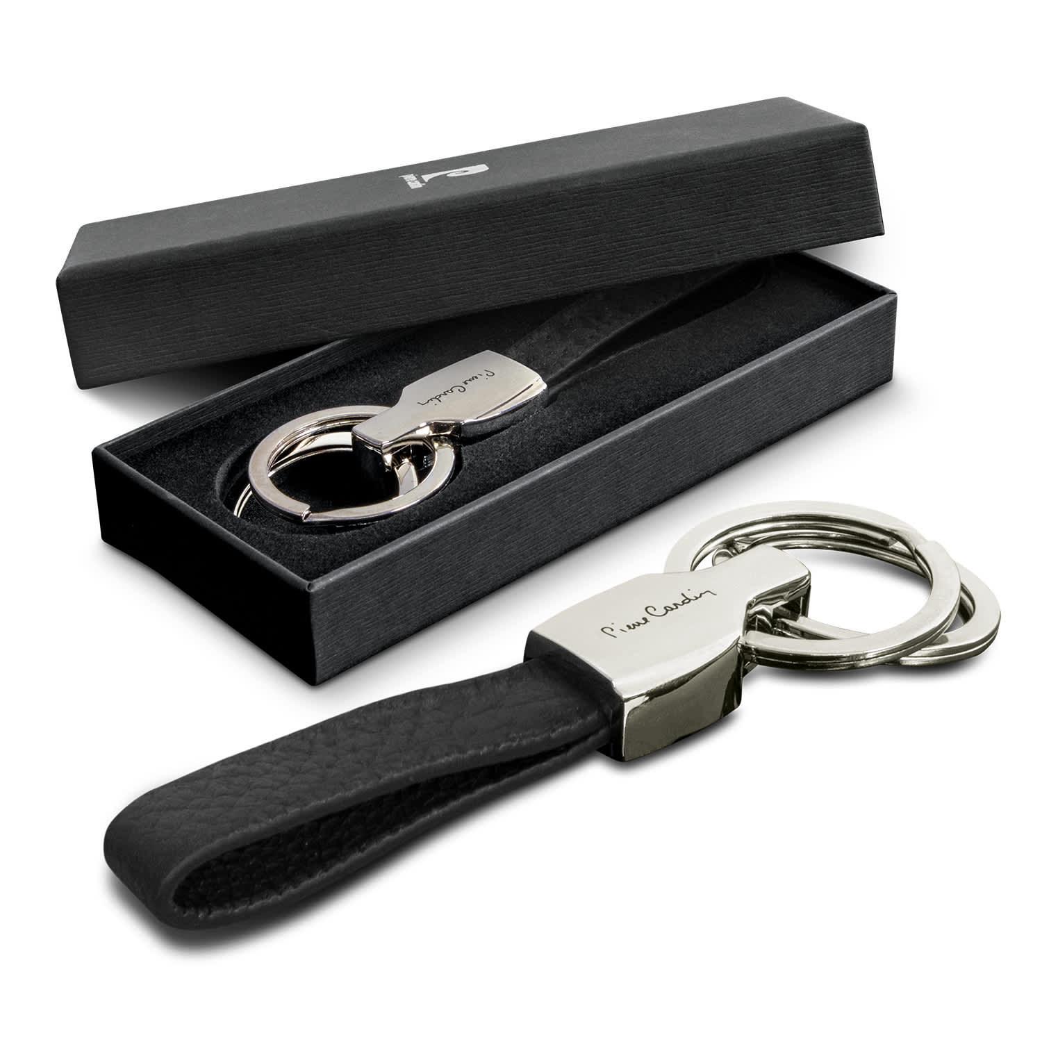 A sleek black key ring with a silver key holder, presented in a black gift box. Pierre Cardin Belfort Key Ring - Image 1