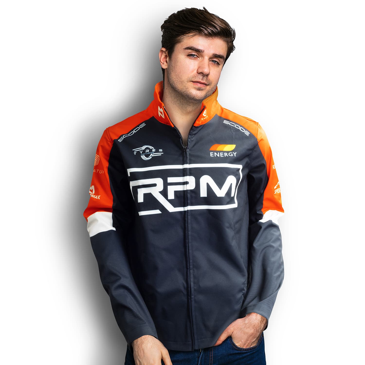 A man is wearing a custom men's premium softshell jacket in grey and orange, featuring a logo on the front. Custom Mens Premium Softshell Jacket - Image 1
