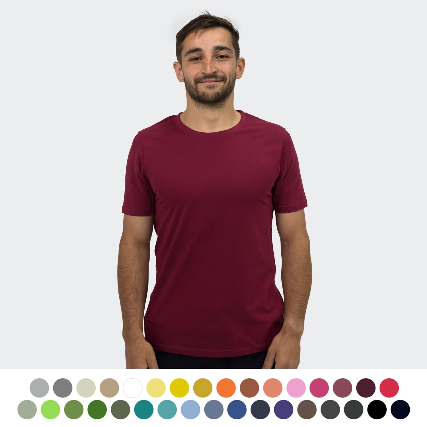 A maroon unisex TRENDSWEAR Element T-shirt displayed on a model, featuring a variety of colour swatches below. TRENDSWEAR Element Unisex T-Shirt - Image 1