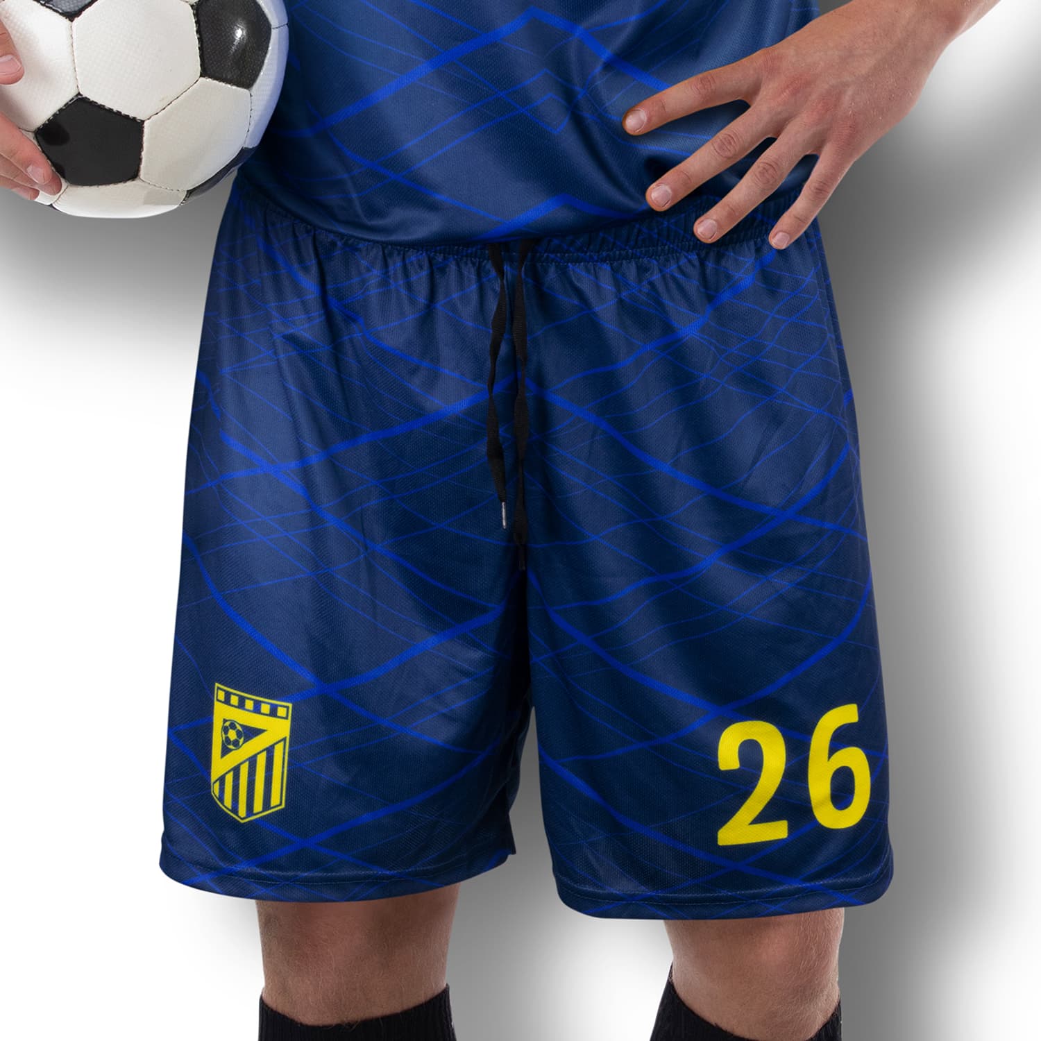 Men’s soccer shorts in navy blue with a wavy pattern, featuring a logo and the number 26. Holds a soccer ball. Custom Mens Soccer Shorts - Image 1
