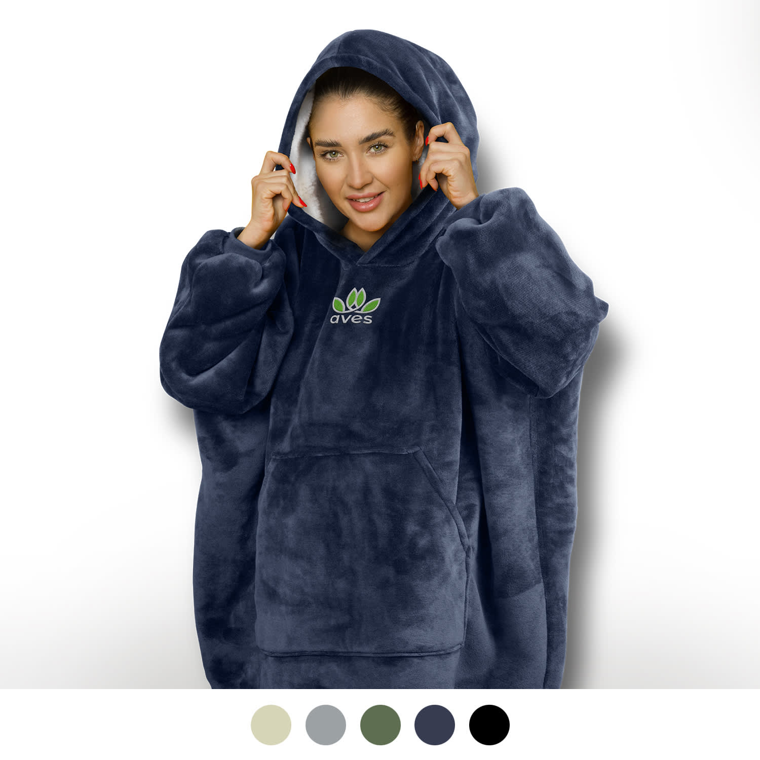 A woman wearing a navy blue hoodie blanket with a large hood and a front pocket, featuring a logo. Nimbus Blanket Hoodie - Image 1