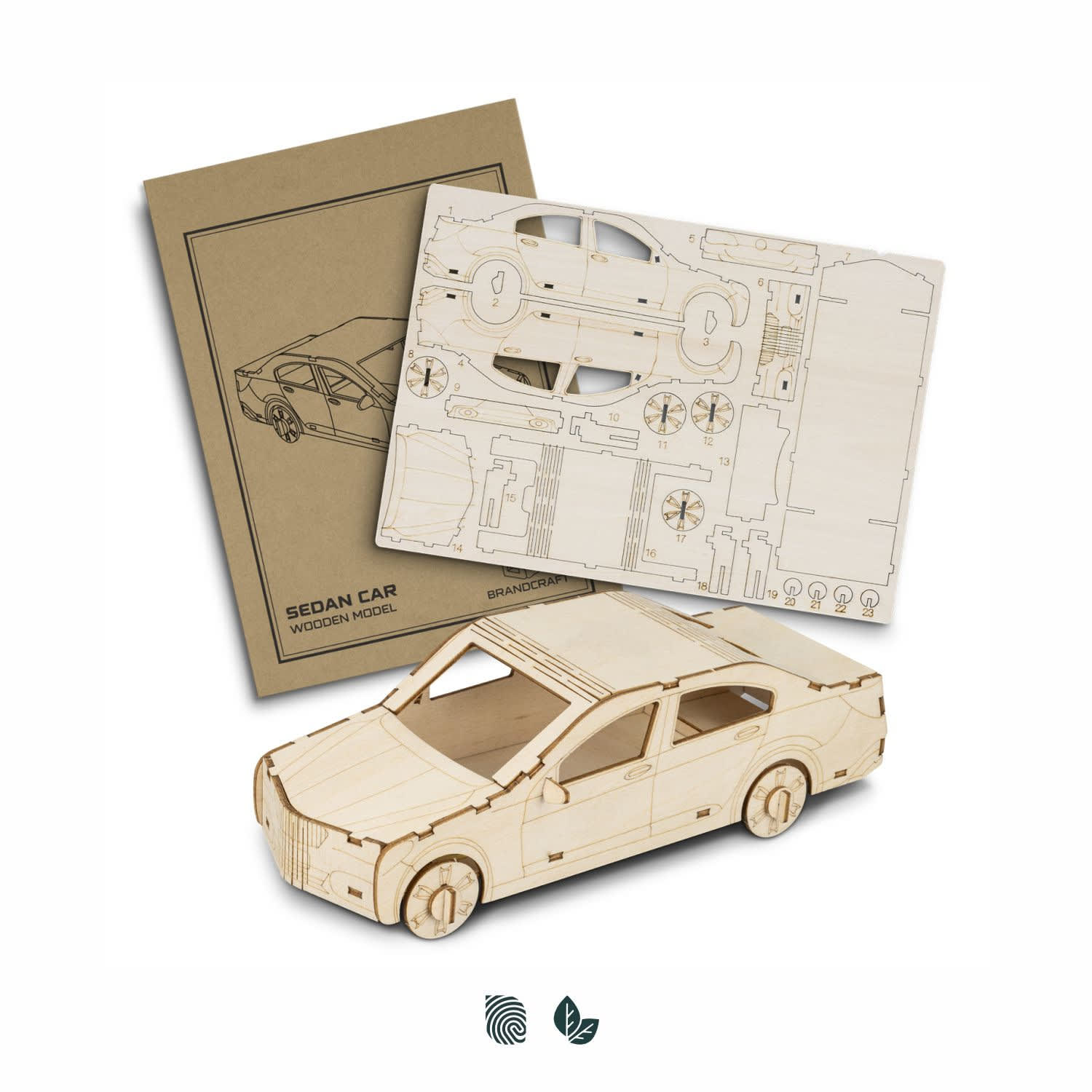 A wooden model of a sedan car, unassembled parts, and instructions in a neutral colour scheme. BRANDCRAFT Sedan Car Wooden Model - Image 1