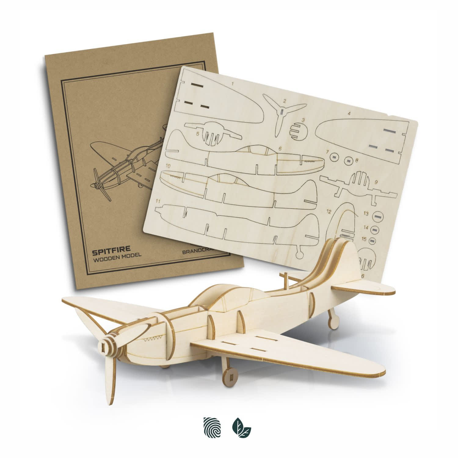 A wooden model of a Spitfire aircraft with laser-cut parts on a backing board, featuring a natural wood finish. BRANDCRAFT Spitfire Wooden Model - Image 1
