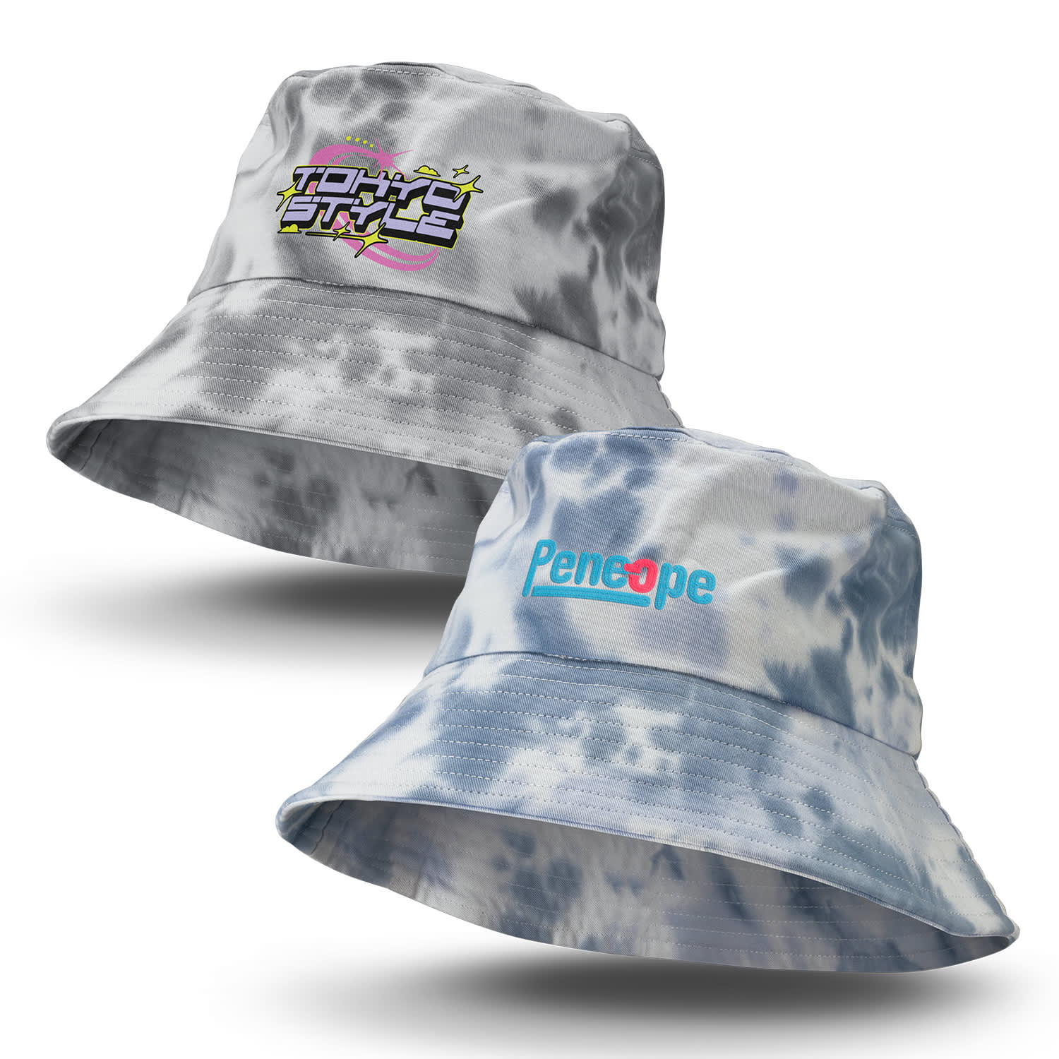 A grey and blue tie dye bucket hat featuring a logo on one side and text on the other. Juniper Tie Dye Bucket Hat - Image 1