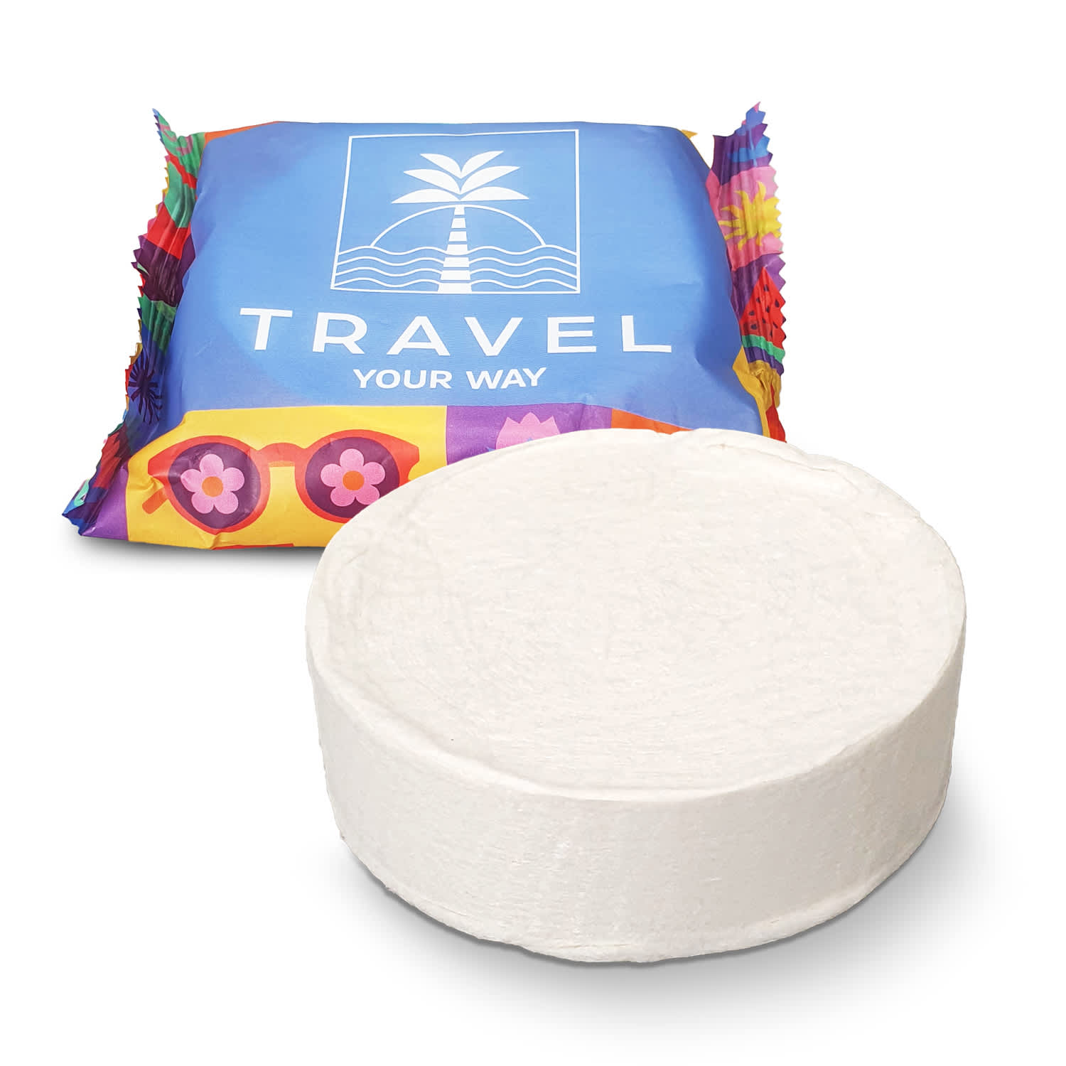 A round white compressed towel in front of colourful packaging featuring a logo. Compressed Towel - Image 1
