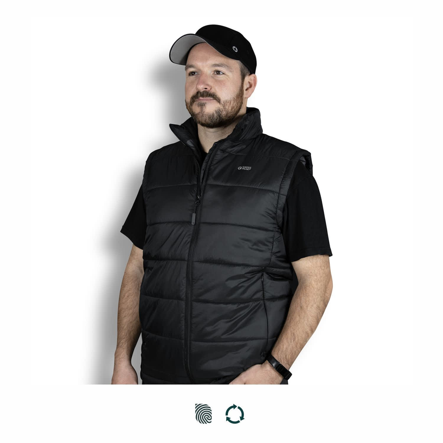 A man wearing a black puffer vest, featuring a zip closure and high collar, with a logo on the chest. Swiss Peak Urban Puffer Vest - Image 1