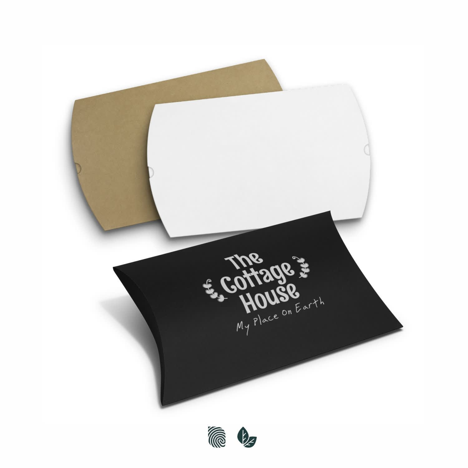 A set of extra-large pillow boxes in white, brown, and black colours, featuring a logo and decorative text. Pillow Box - Extra Large - Image 1
