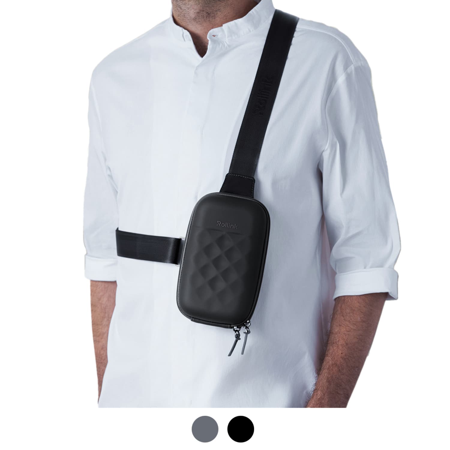 A black roll-top mini bag worn across a person’s body, featuring a quilted design and adjustable strap. Rollink Mini Bag Go - Image 1