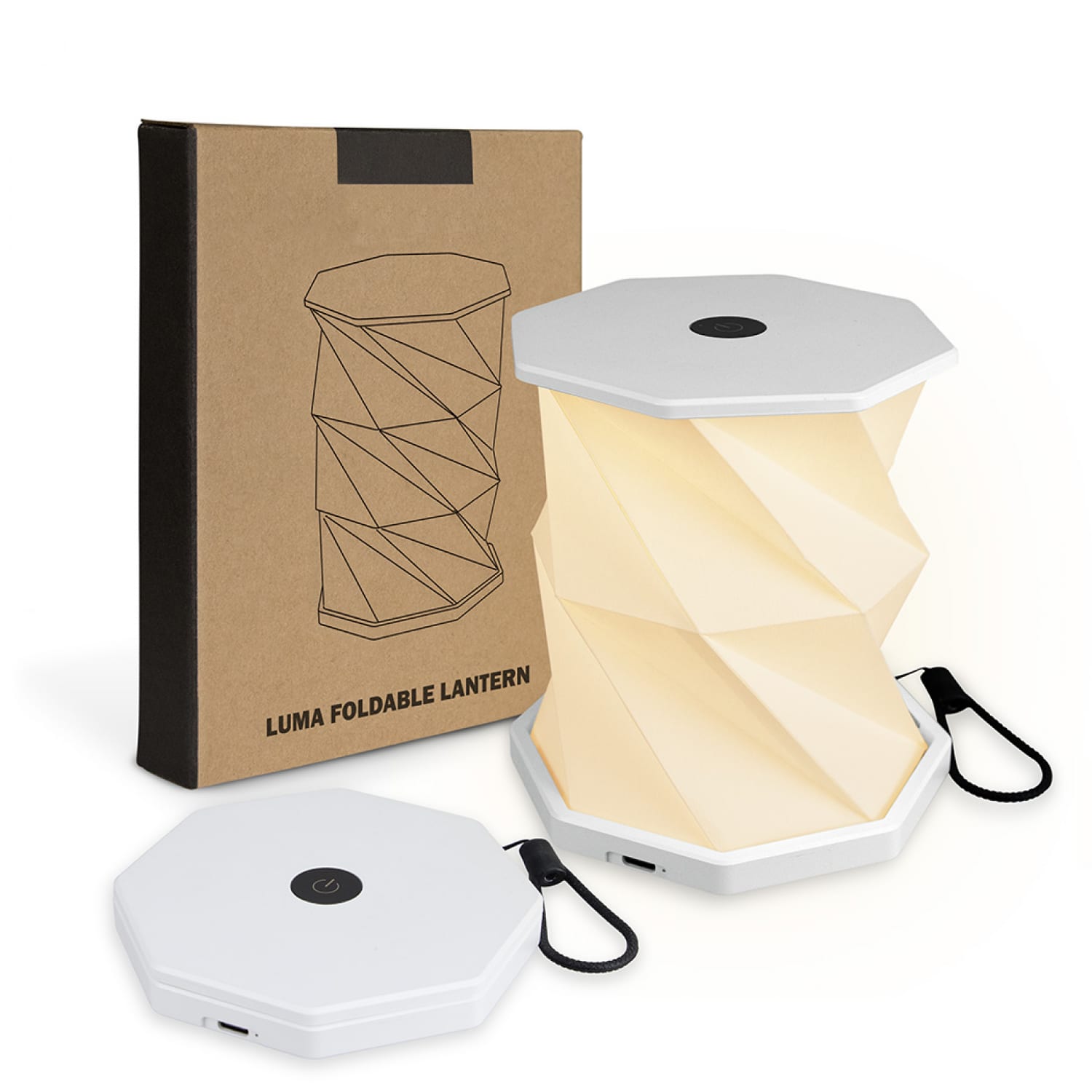 A foldable lantern in white, displayed with its packaging, featuring a unique twisted design. Luma Foldable Lantern - Image 1
