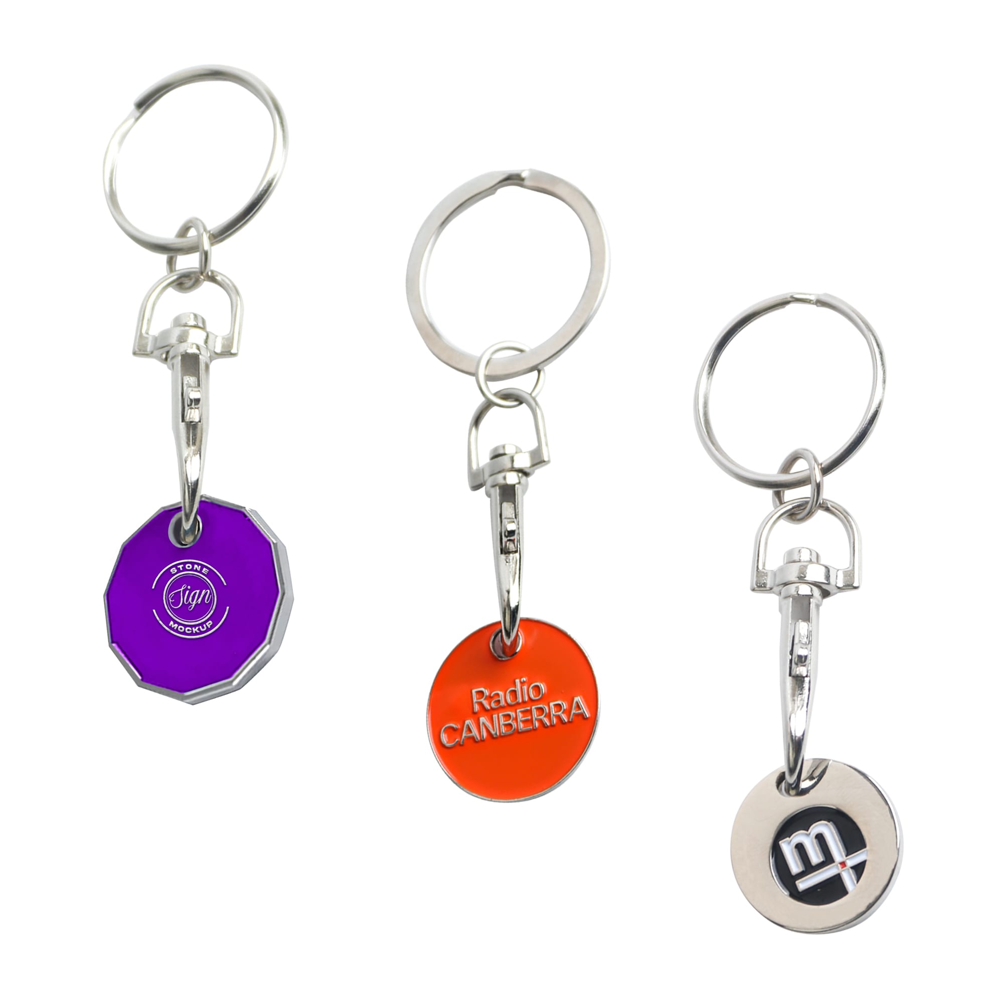 Three enamel trolley coin keyrings in purple, orange, and silver, each attached to a metal keyring. Enamel Trolley Coin Keyring - Image 1