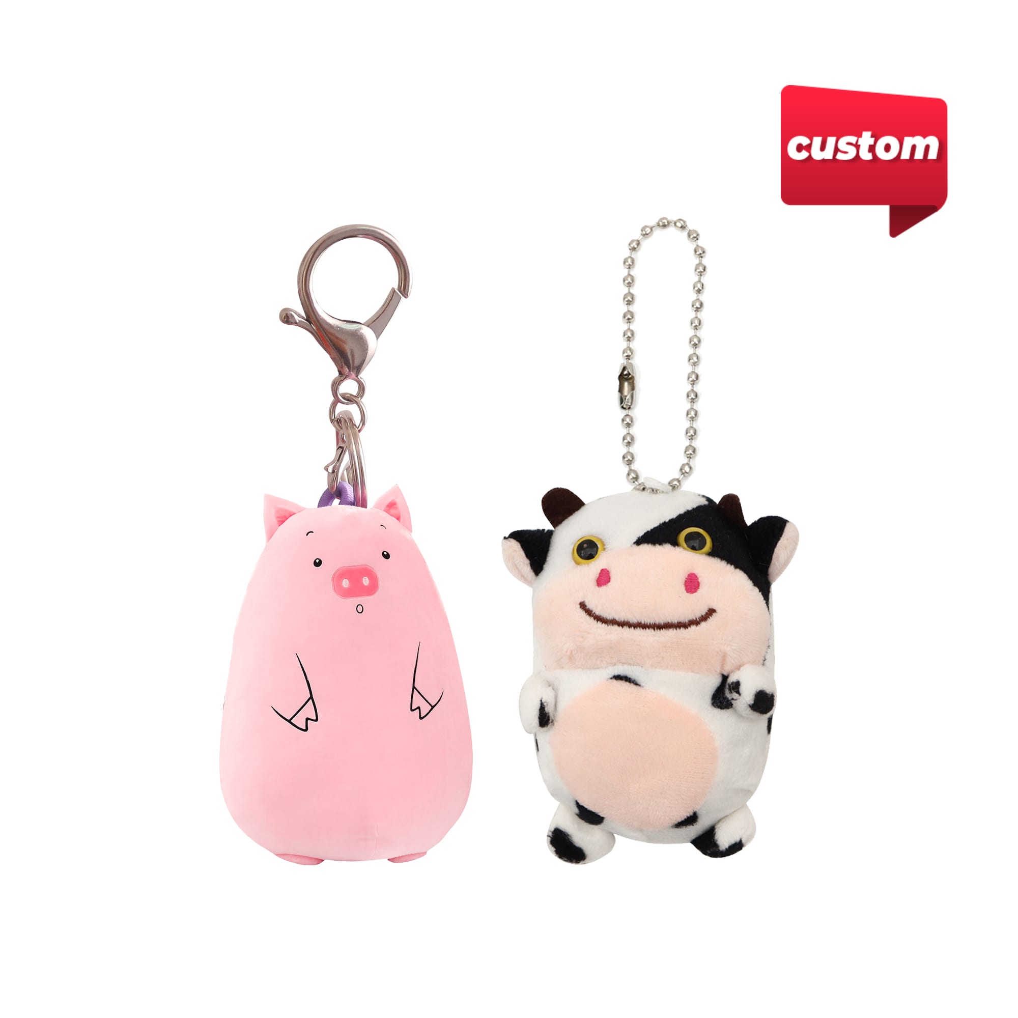 Two custom animal keyrings, featuring a pink pig and a cow, with metal clasps and a ball chain. Custom Animal Keyrings - Image 1