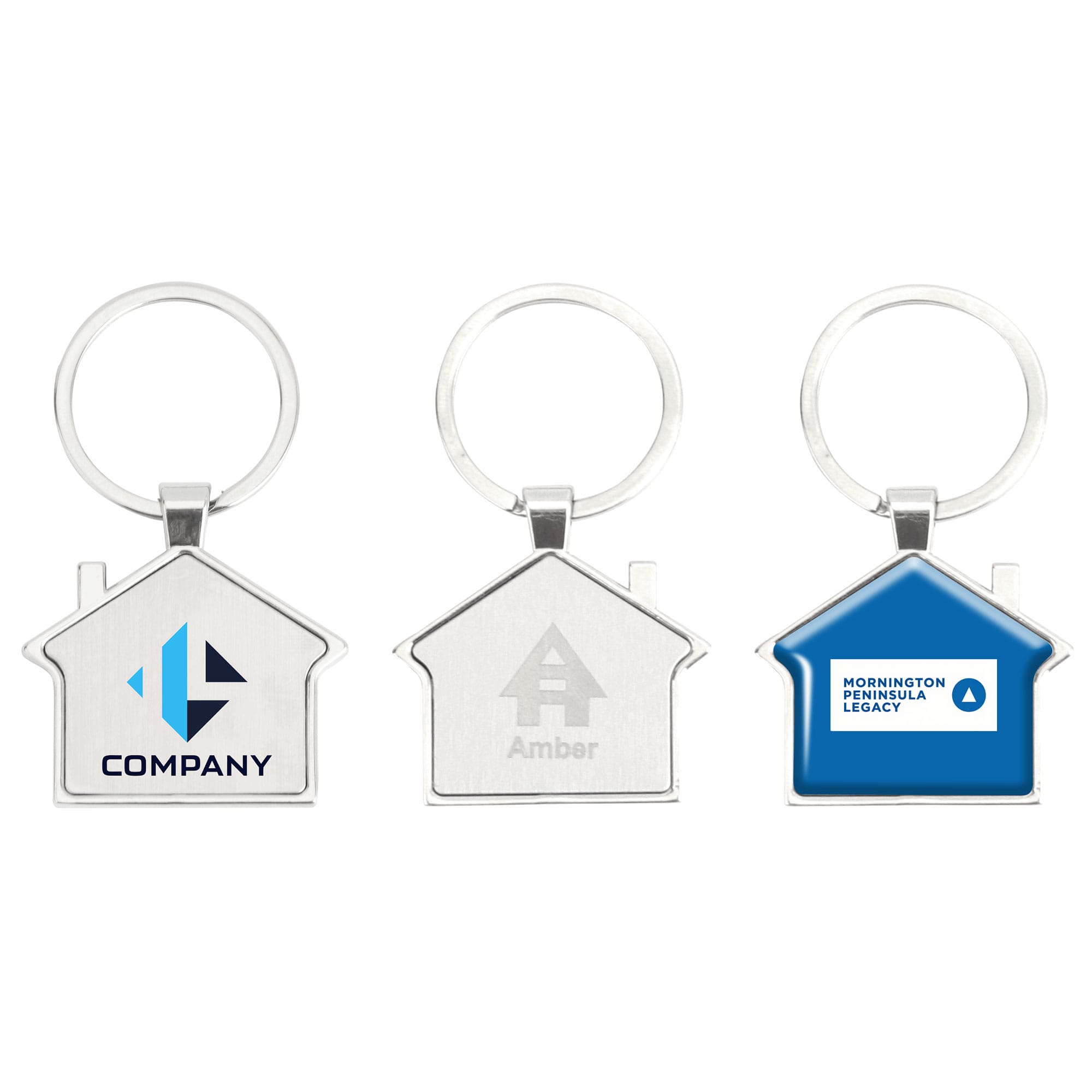 A collection of three metal house-shaped keyrings in silver and blue, featuring different branding designs. House Metal Keyring - Image 1