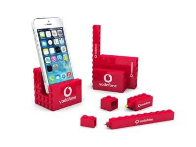 A red stationery set featuring various items including a phone stand, pen, and blocks, all displaying a logo. 3Pcs Stationery Set - Image 1