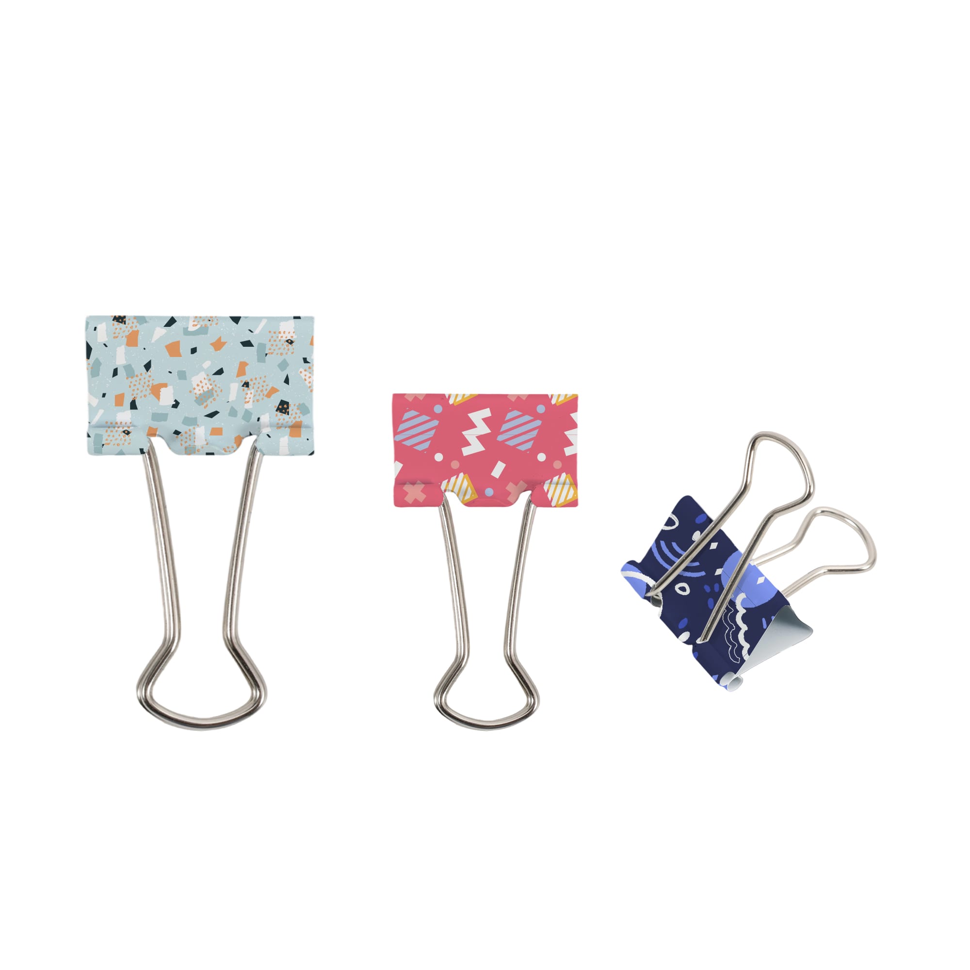 Three binder clips in various designs: a blue one with patterns, a pink one with a playful style, and a dark blue one with a unique print. Binder Clip - Image 1
