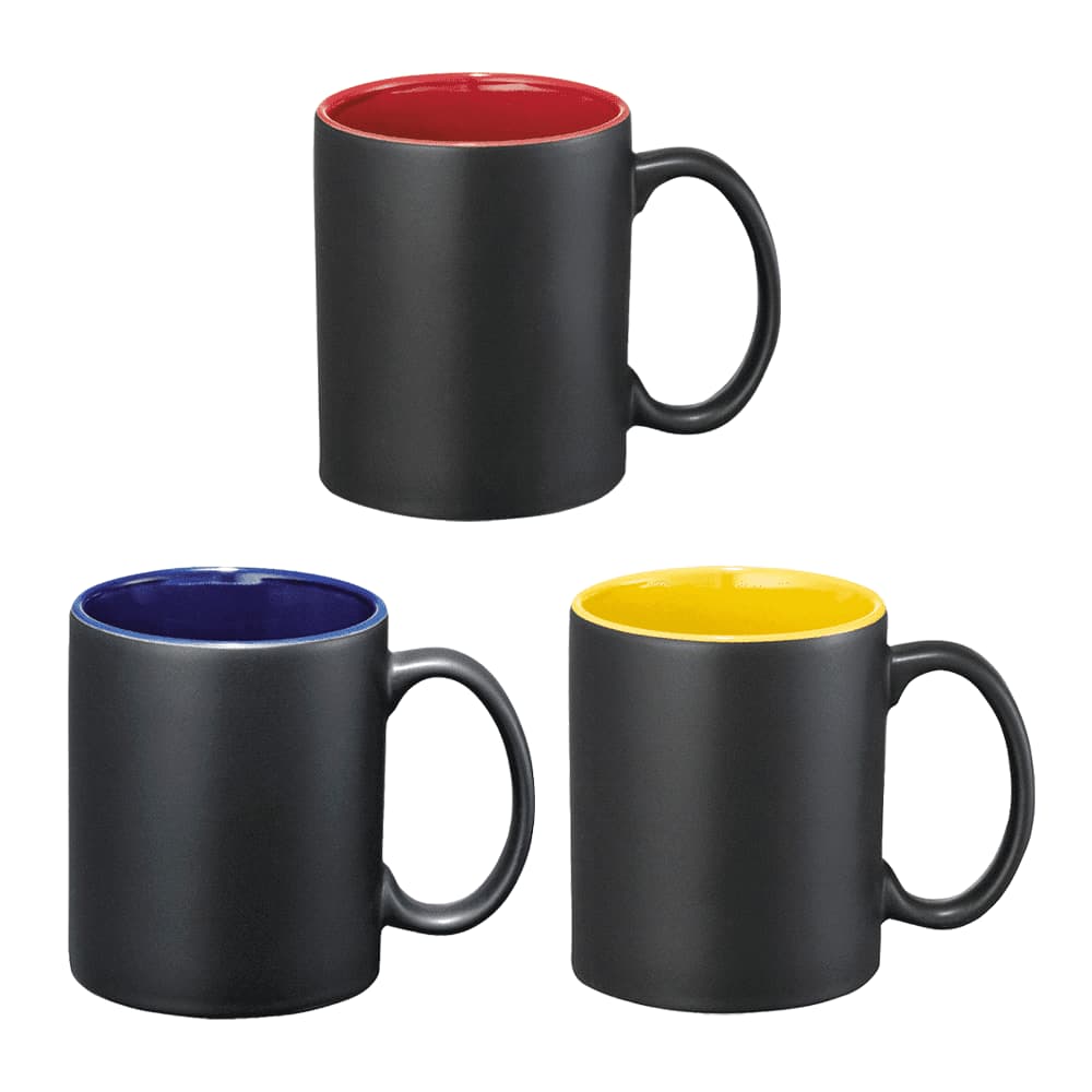 A set of three ceramic mugs in black with red, blue, and yellow interiors, each with a handle. Each mug is shown against a white background and has a logo. Maya Ceramic Mug 325ml In Box - Image 1