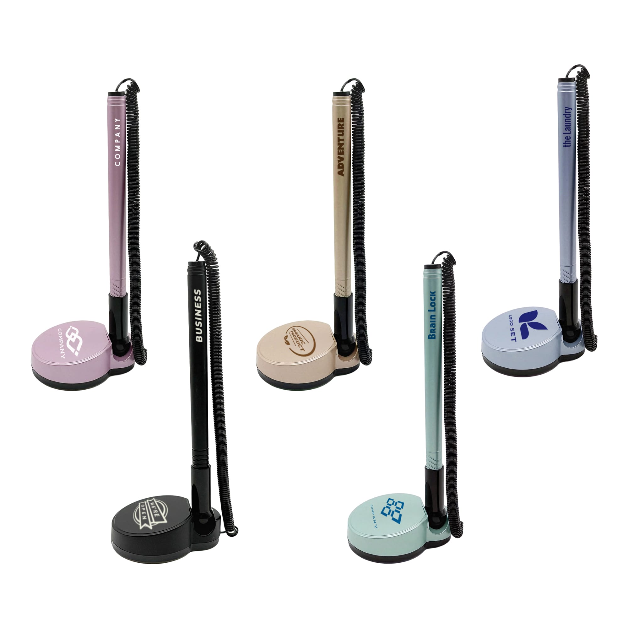 A set of five fixed signature pens on stands, featuring pastel colours like pink, beige, and blue, with various branding. Counter Fixed Signature Pen D - Image 1