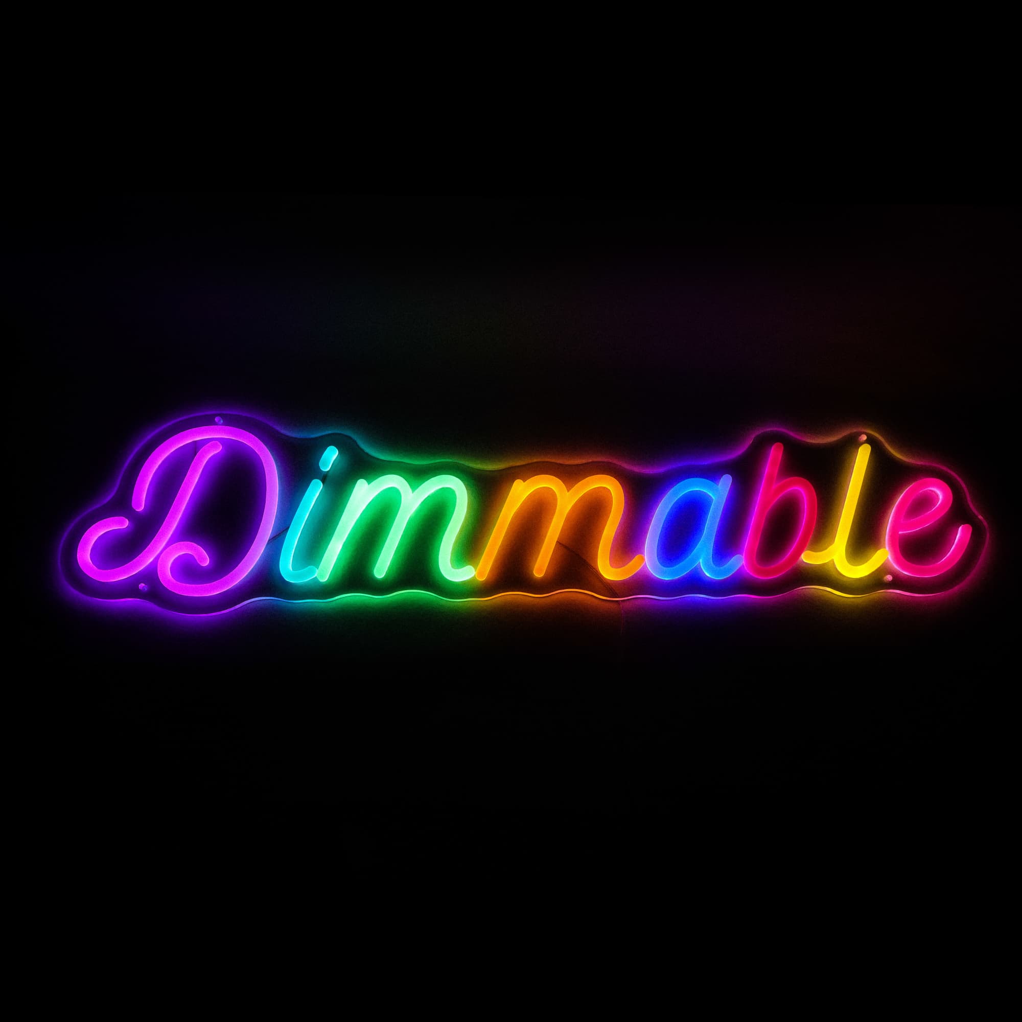 A brightly lit, multicoloured neon LED sign reading "Dimmable" in a curvy font. It features a glowing effect against a dark background. Dimmable Neon LED Sign - Image 1