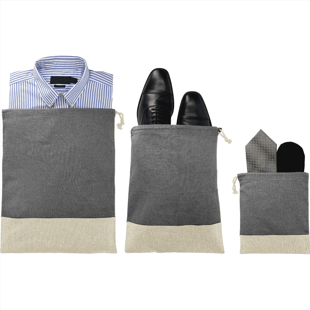 Three grey and beige travel pouches, each containing a shirt, shoes, and accessories like a tie and socks. Split Recycled 3pc Travel Pouch Set - Image 1