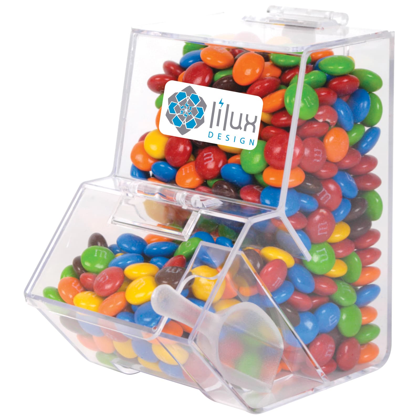 A clear dispenser filled with colorful M&M's chocolate candies, featuring a branded label on the front. M&M's in Dispenser - Image 1