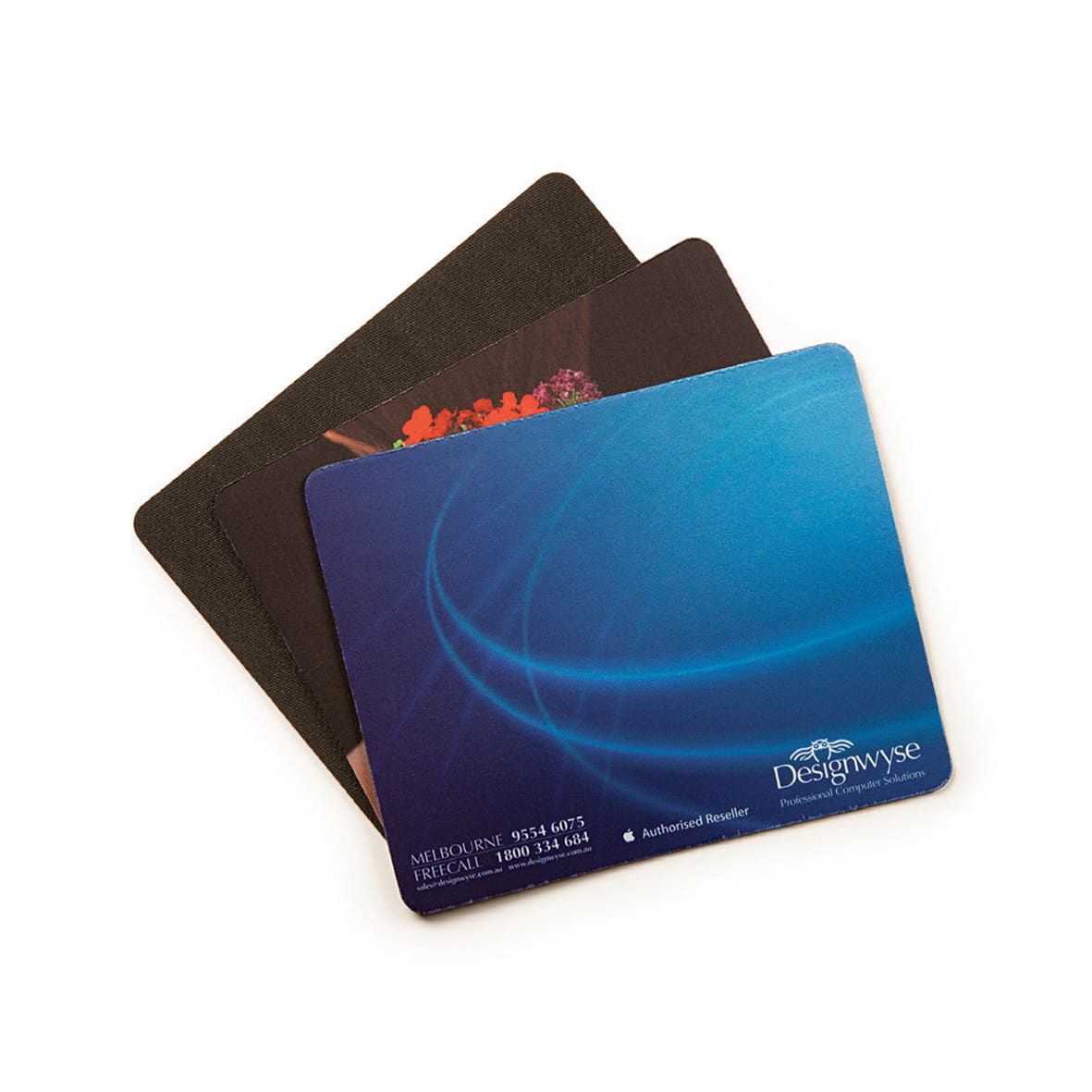 Three natural rubber fabric mouse mats in varying colours and designs, including a dark blue and a textured black. Natural Rubber Fabric Mat - Image 1