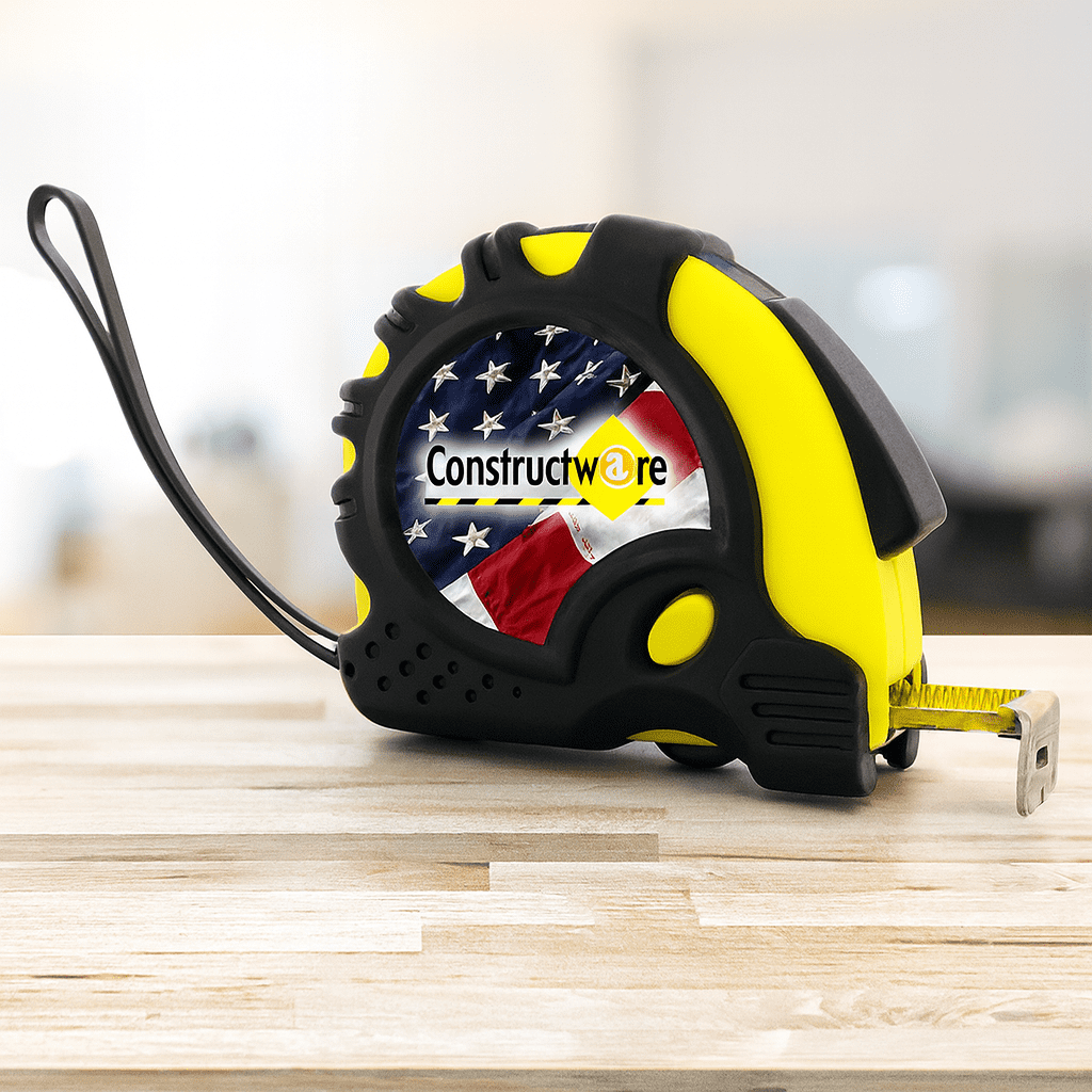 A tape measure with a yellow and black casing, featuring a design of the American flag on its side. It has a logo. The Carpenter - Image 1