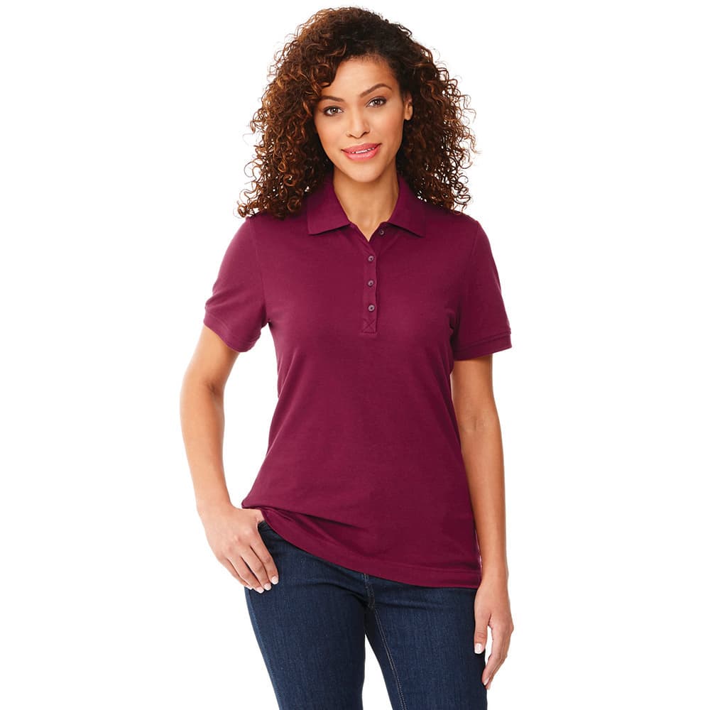 A women's short sleeve polo shirt in a rich burgundy colour, featuring a collar and buttons, with a logo present. Crandall Short Sleeve Polo - Womens - Image 1