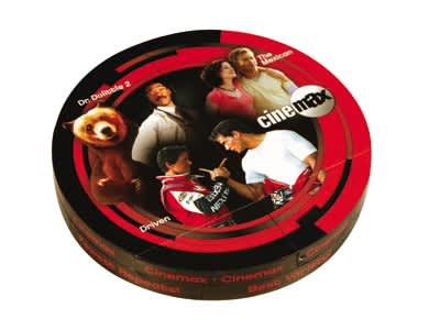 A round, black and red box featuring various characters and images, with a logo on the top. Magic Disk - Image 1
