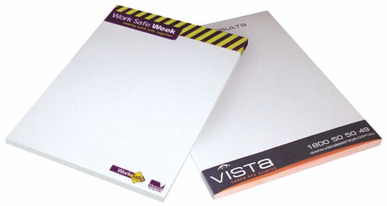 A6 writing pad with 25 blank leaves, featuring a white cover and a logo on the bottom. Ideal for office use. A6 Writing Pad 1c 25 Leaf - Image 1