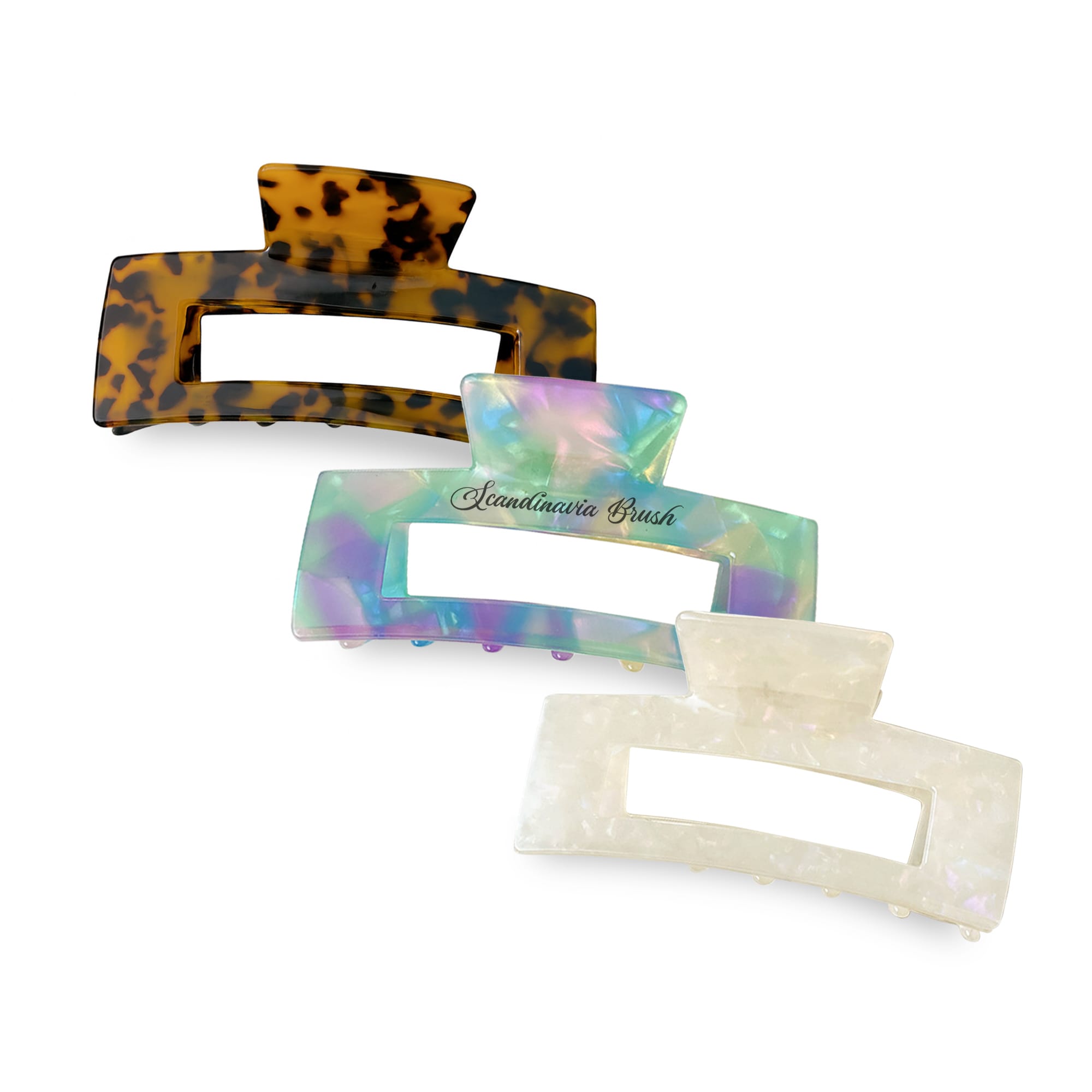 A set of three hair claw clips in tortoiseshell, iridescent, and white colours, featuring a branding logo. Hair Claw Clip - Image 1