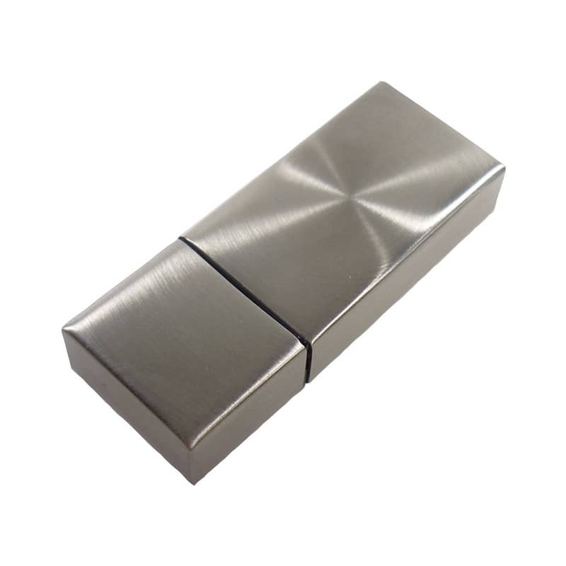 A metallic flash drive in a sleek, rectangular design with a brushed finish and a logo. Metallica Flash Drive - Image 1