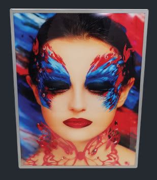 A slimline light box featuring an artistic portrait with vibrant blue and red butterfly makeup on a model. Light Boxes -Slimline Light Box A1 - Image 1