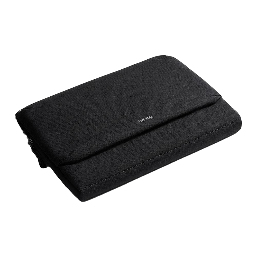 A sleek black laptop caddy with a simple design and a logo. It features a zip closure and a padded exterior. Bellroy 16" Laptop Caddy - Image 1