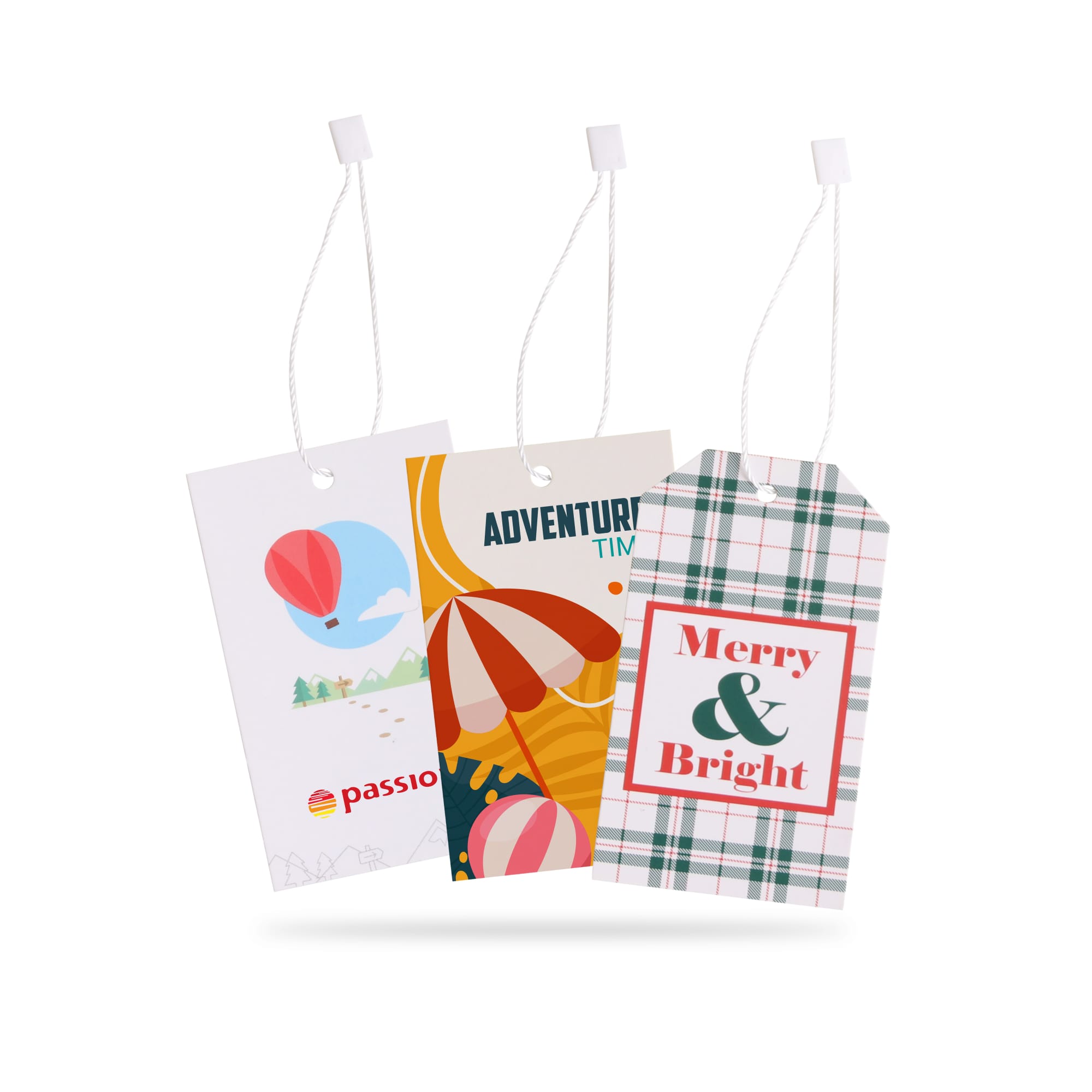 Three colourful swing tags with designs featuring a hot air balloon, beach umbrella, and festive plaid patterns. Each tag has a white string. Swing Tags - Image 1