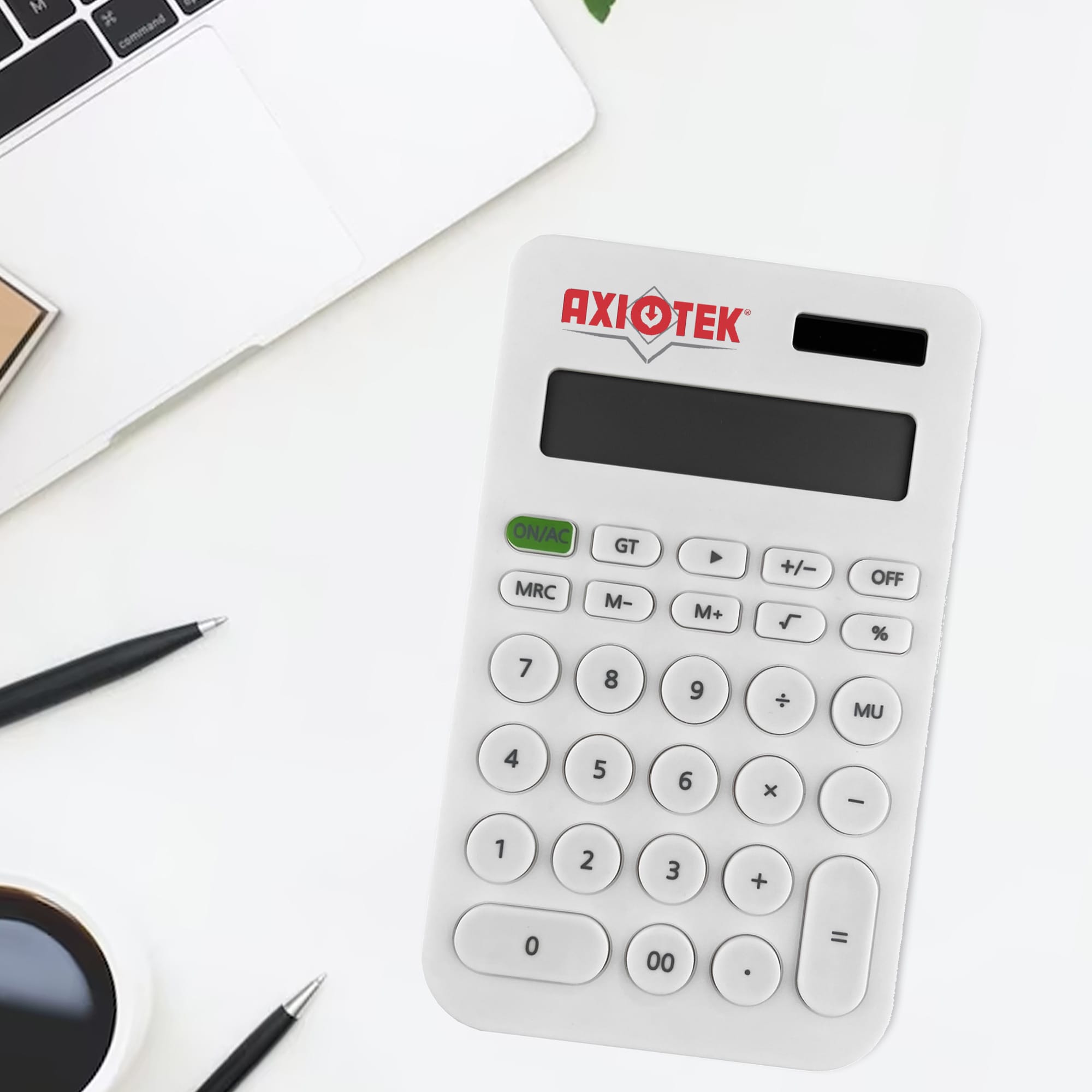 A white calculator with a logo, displaying numbers and various function keys, on a desk with a laptop and stationery. Canio Calculator - Image 1