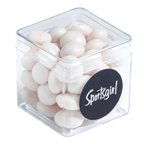 A clear cube container filled with white chewy mints, featuring a circular black logo. Hard Cube with Chewy Mints 40g - Image 1