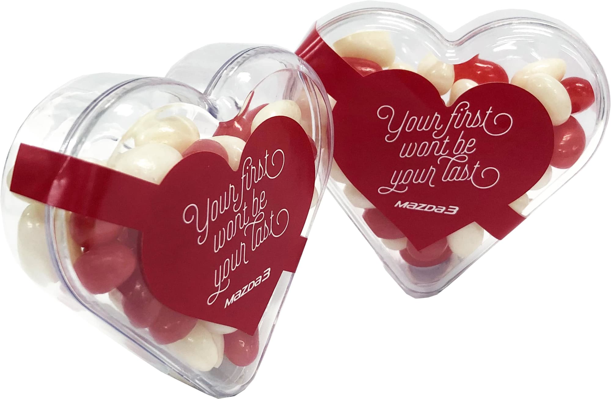 Acrylic heart-shaped container filled with red and white mini jelly beans. It features a logo on the packaging. Acrylic Heart with Mini Jelly Beans 50g - Image 1