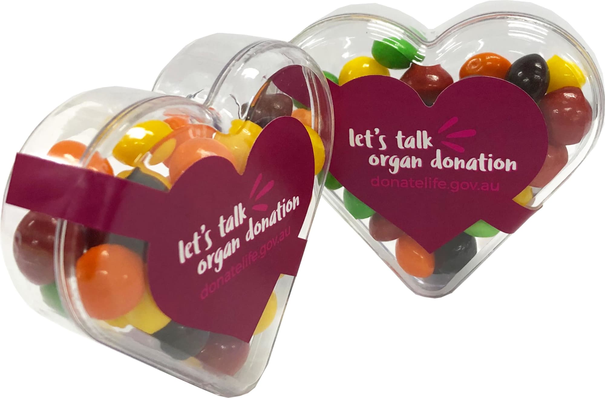 Acrylic heart-shaped container filled with colourful Skittles, featuring a logo on one side. Acrylic Heart with Skittles 50g - Image 1