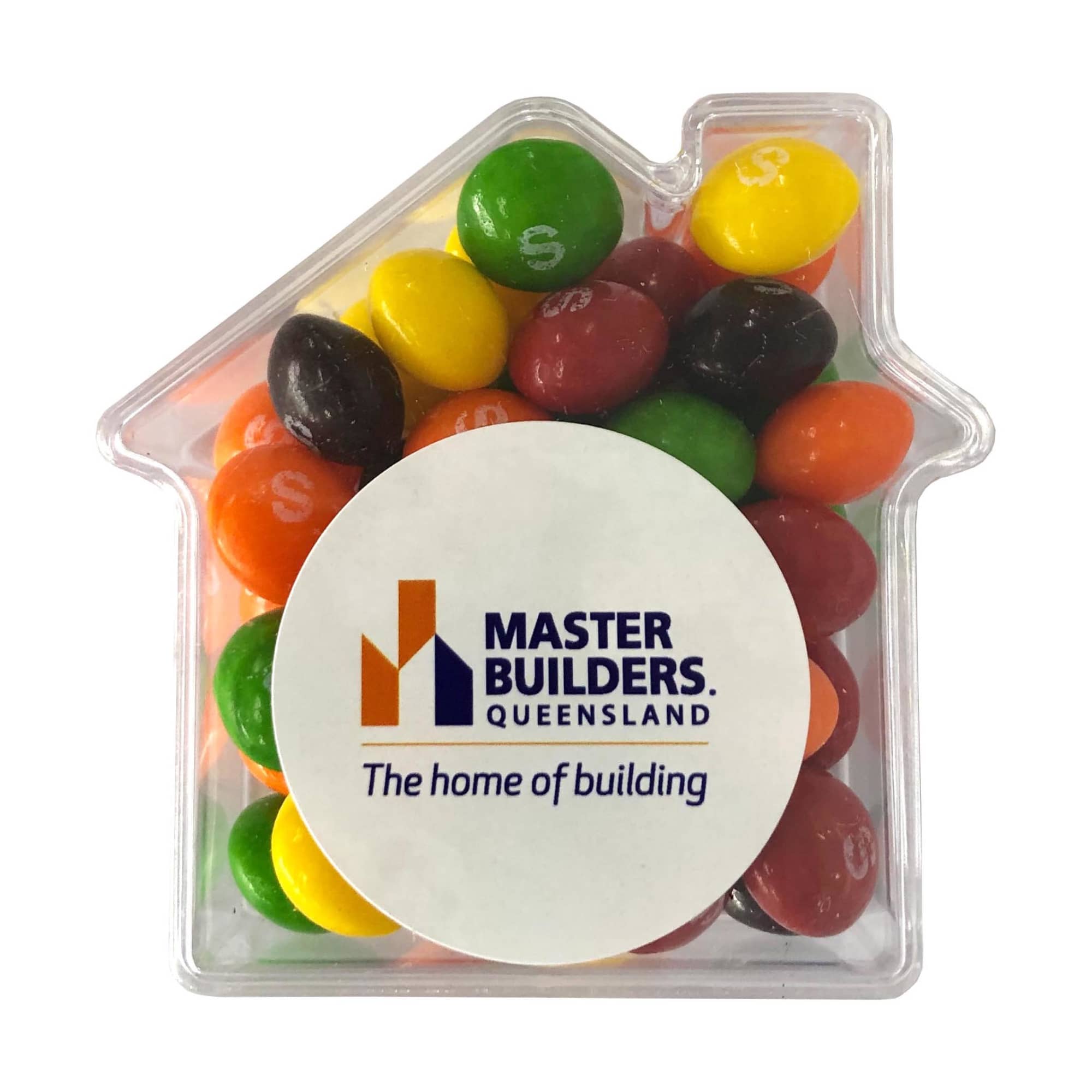 A clear acrylic house-shaped container filled with colourful Skittles in various shades. It features a logo on the front. Acrylic House with Skittles 50g - Image 1