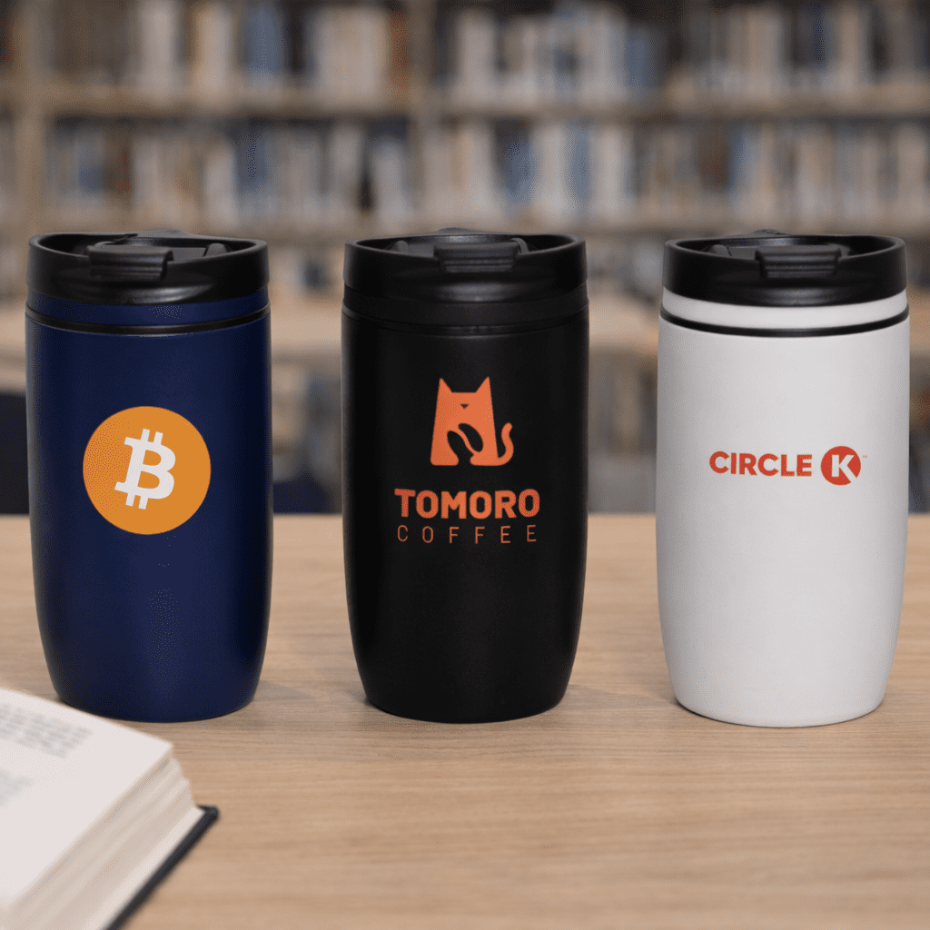A drink bottle set featuring a navy blue, black, and white vacuum cup, each with a logo. The Roamer 300ml Vacuum Cup - Image 1
