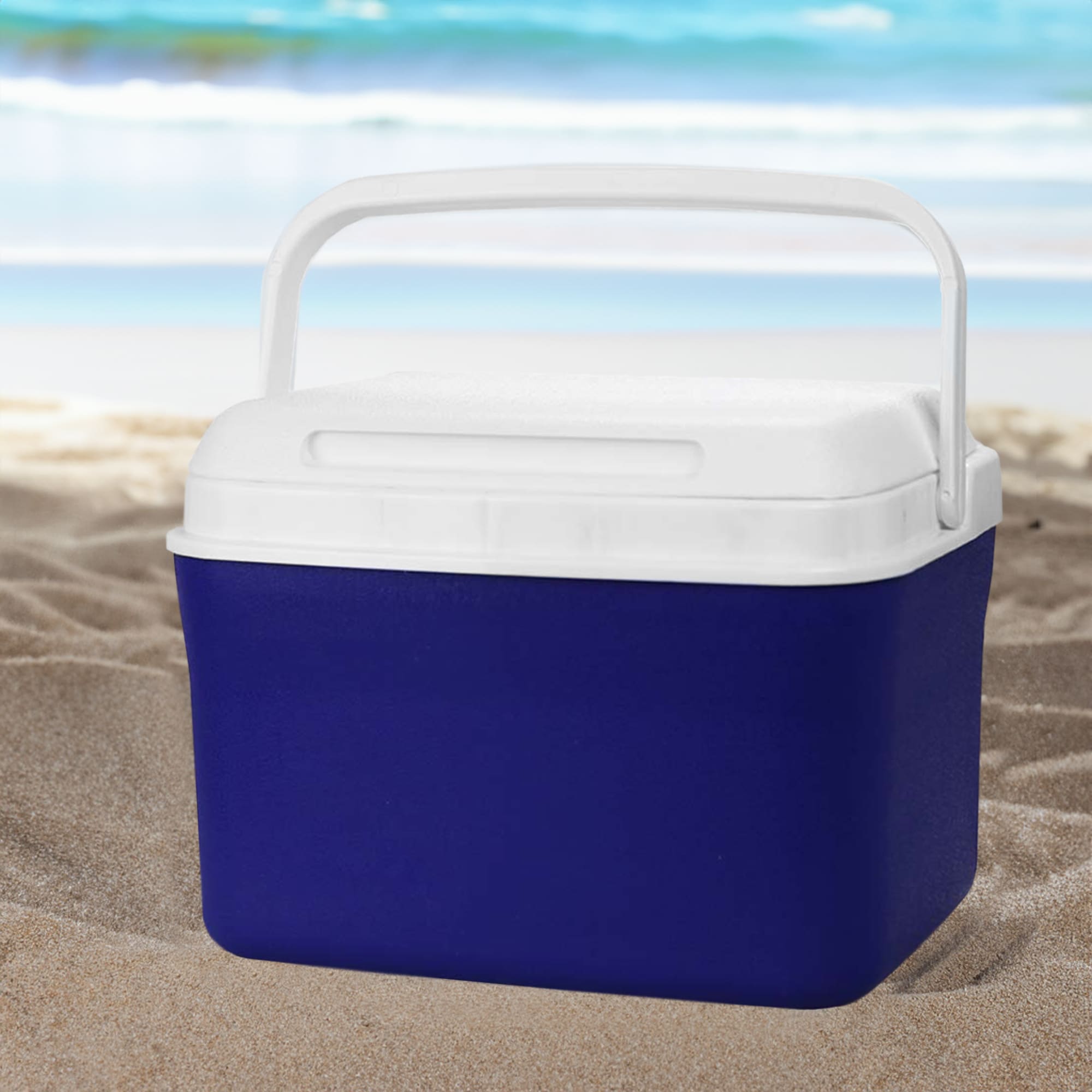 A cooler box in navy blue with a white lid and handle, set against a beach background. Dunkin Cooler Box 4.5L - Image 1
