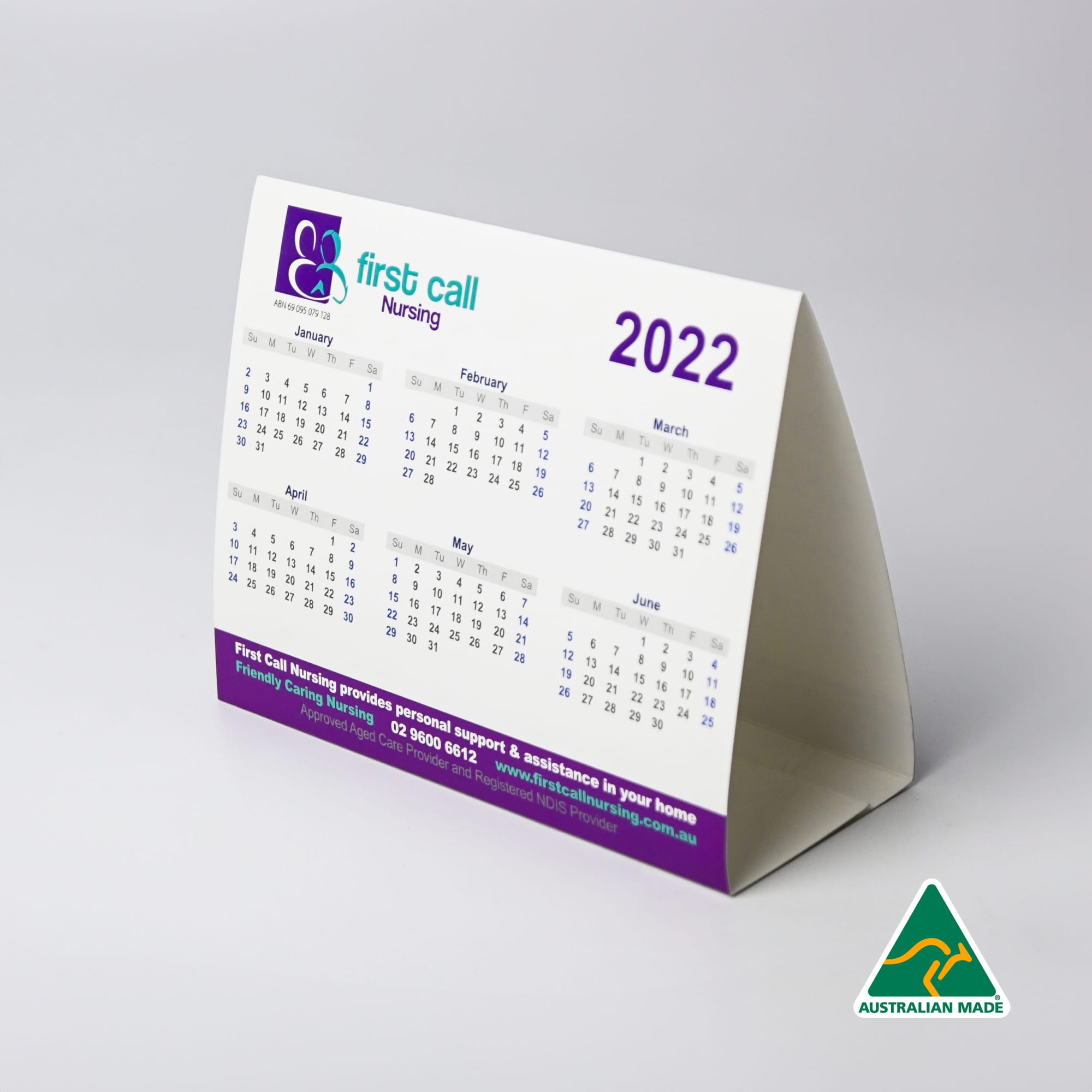 A desk calendar featuring a white background with purple accents, displaying month grids for 2022. It has a logo. Desk Calendar - Image 1