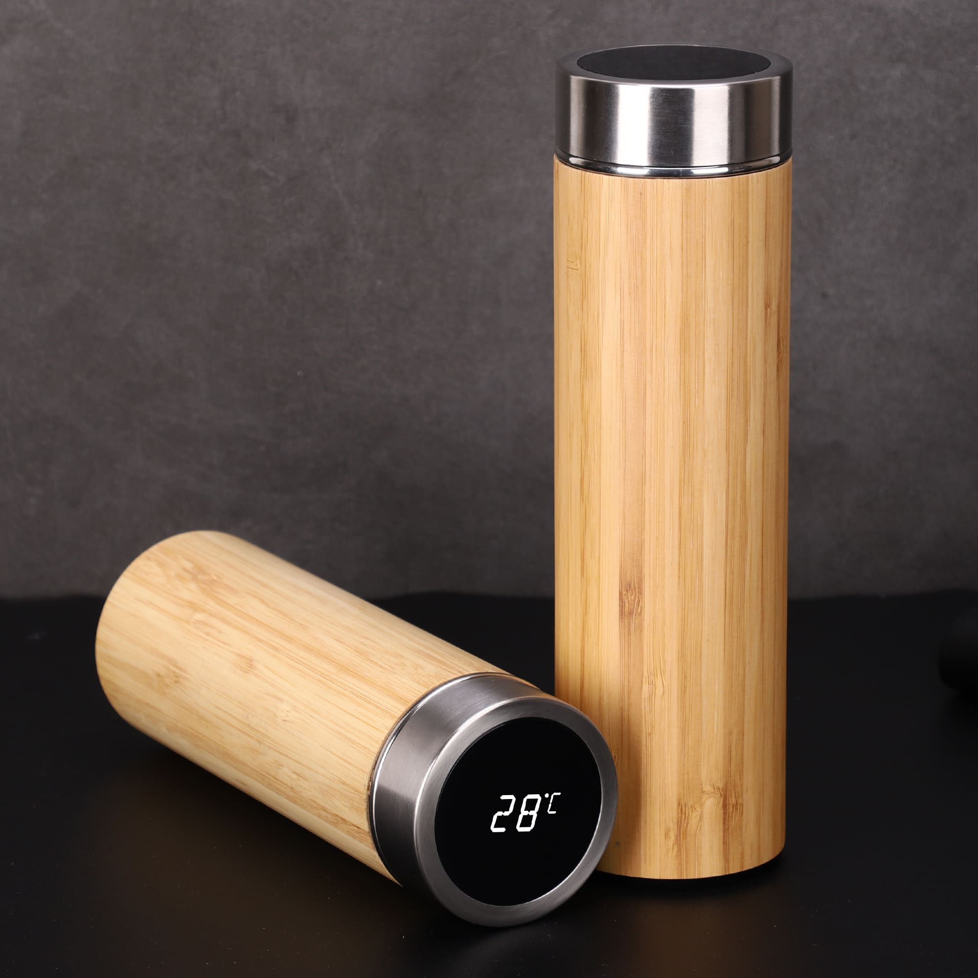 A drink bottle featuring a bamboo exterior and stainless steel accents, with a digital display showing temperature. Duke Smart Bamboo Drink Bottle - Image 1